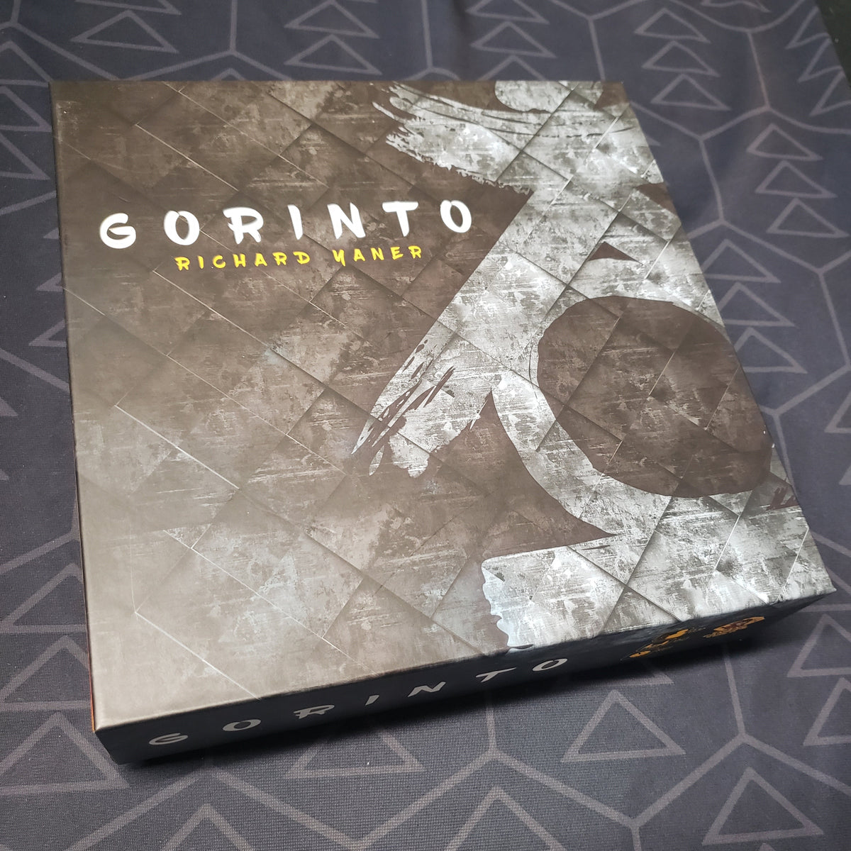 Image shows the front cover of the box for the Gorinto board game