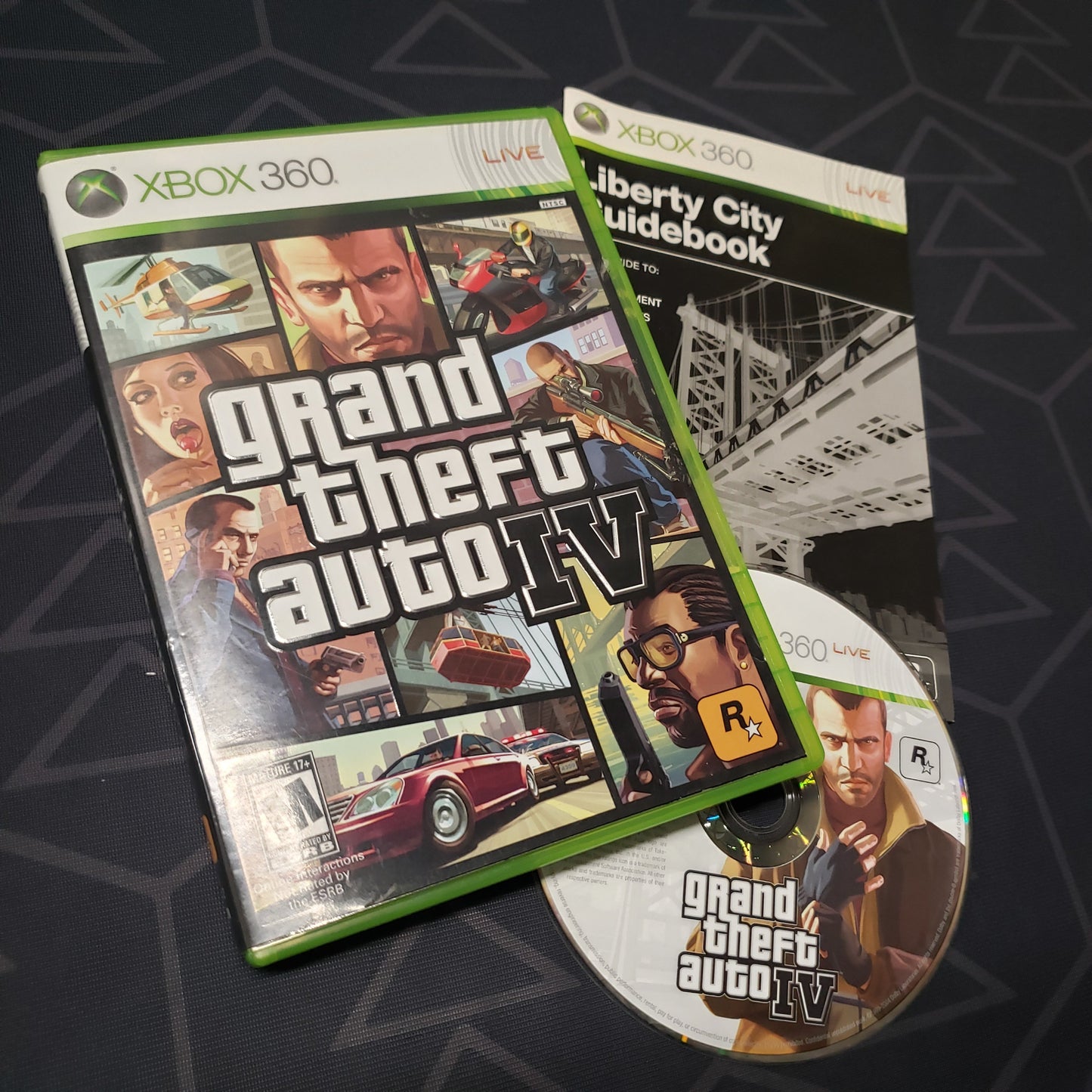 Image shows the case, manual and disc for the video game Grand Theft Auto IV for Xbox 360