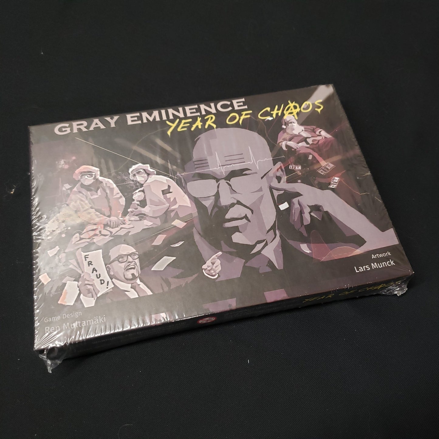 Image shows the front cover of the box of the Year of Chaos expansion for the board game Gray Eminence