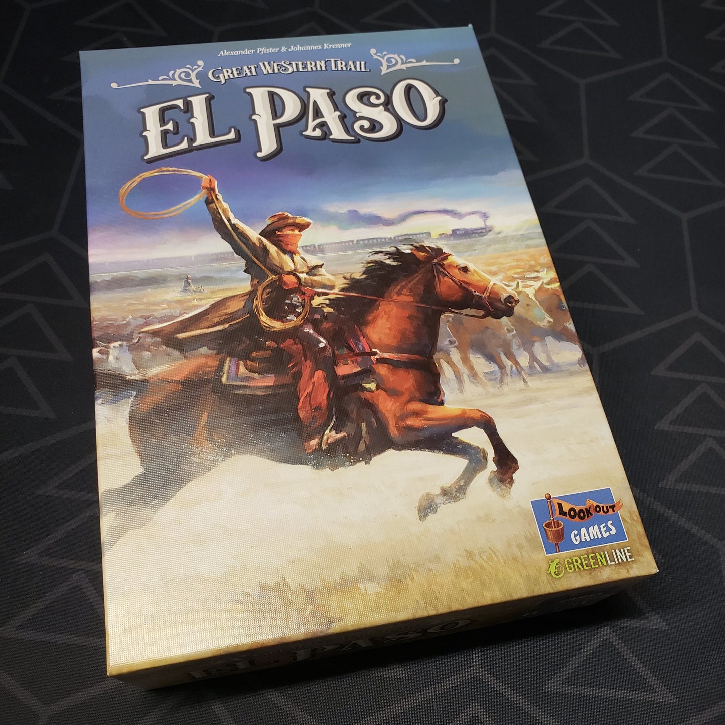 Image shows the front cover of the box for the Great Western Trail: El Paso board game