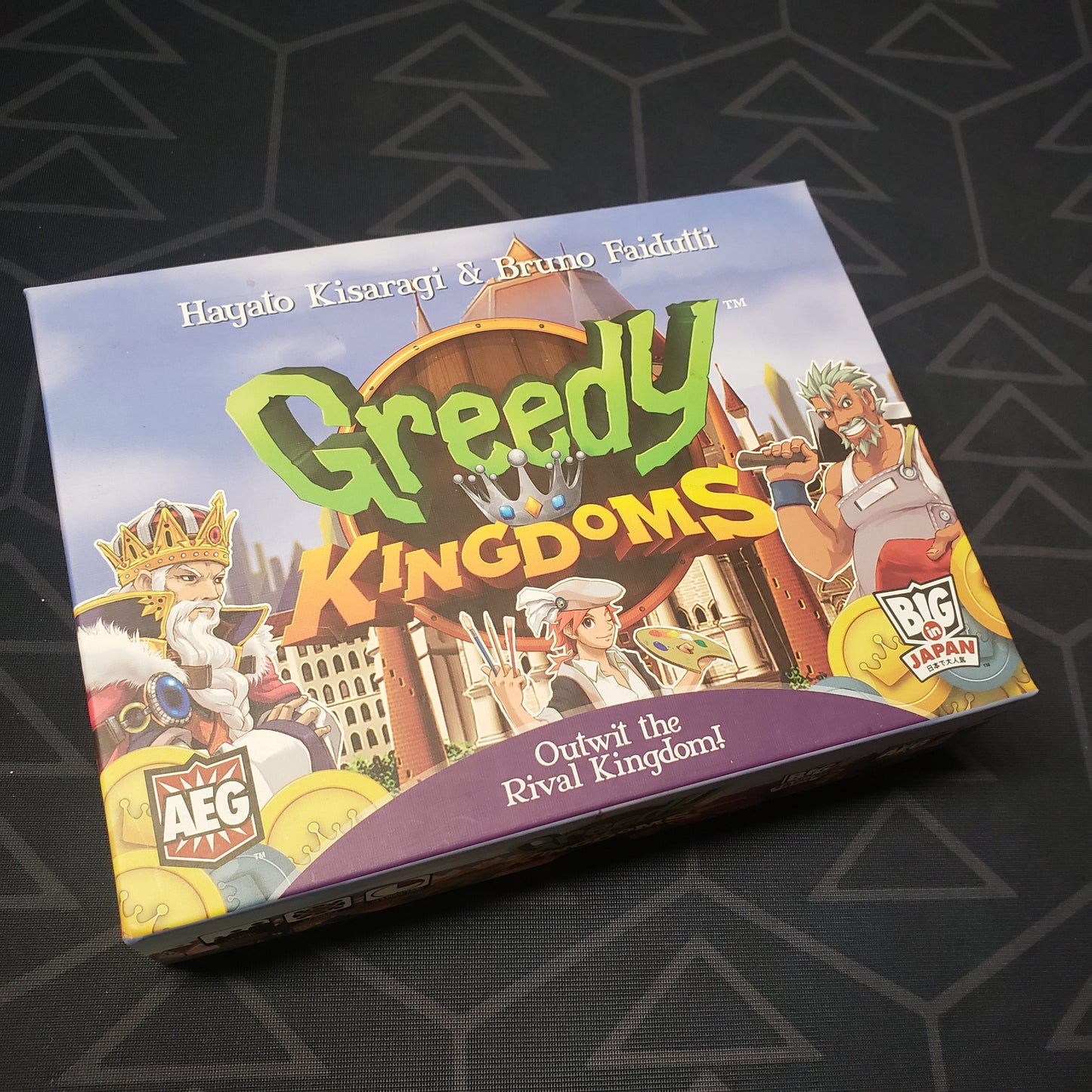 Image shows the front cover of the box of the Greedy Kingdoms board game