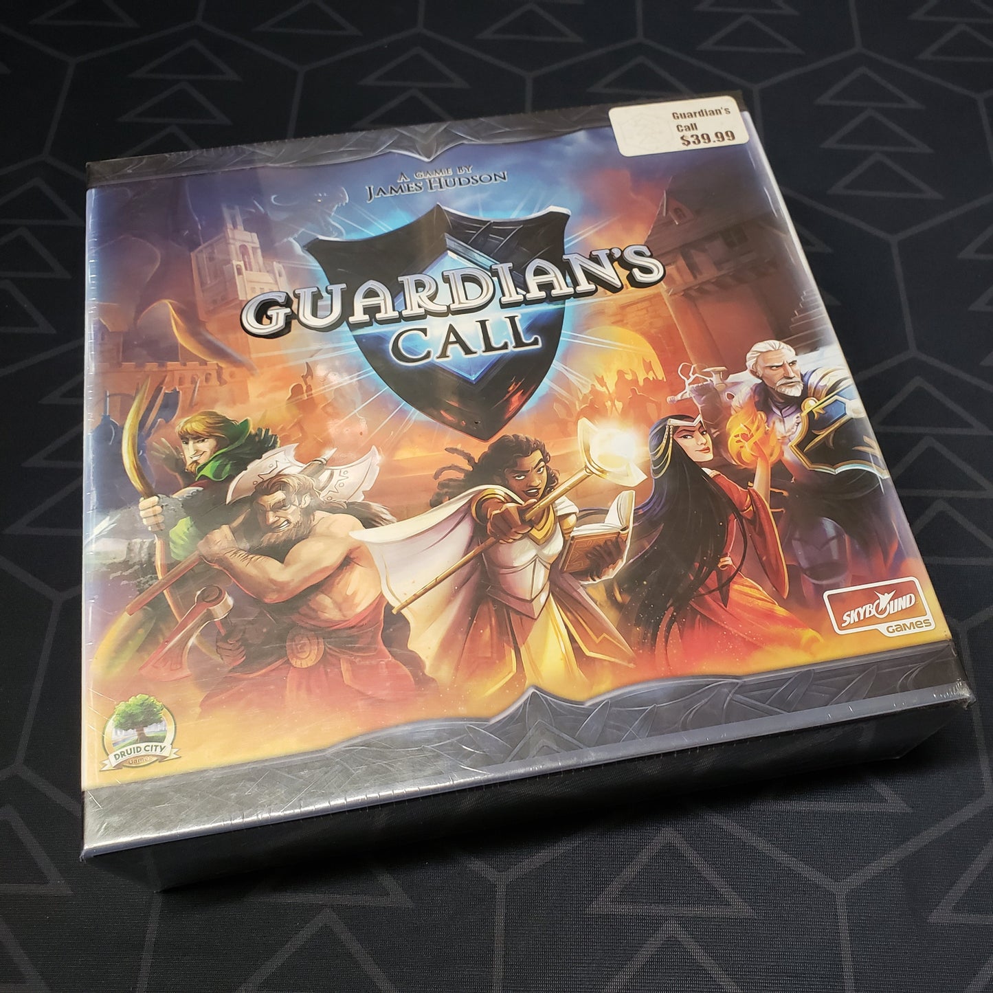 Image shows the front cover of the box of the Guardian's Call board game