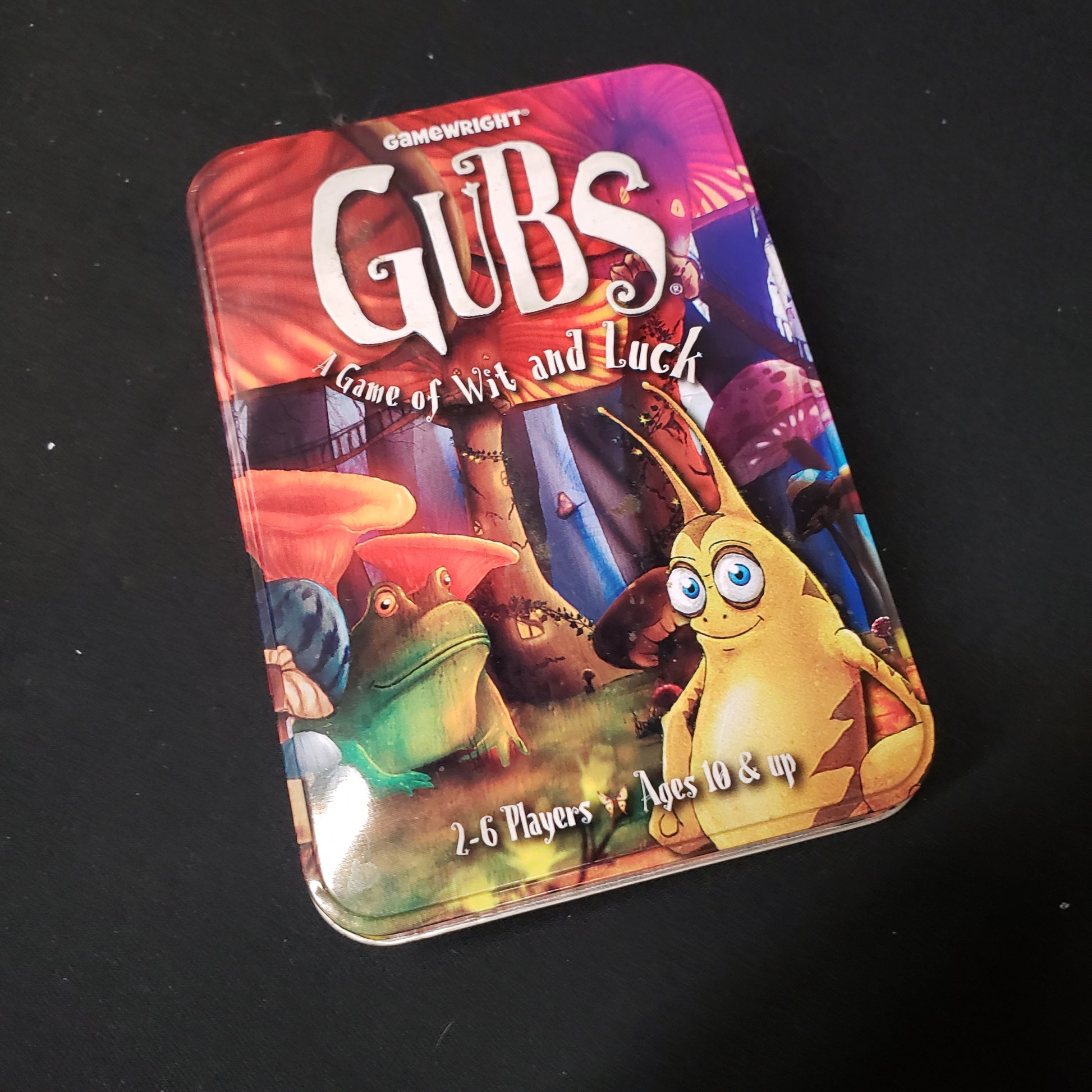 Image shows the front cover of the box of the GUBS card game