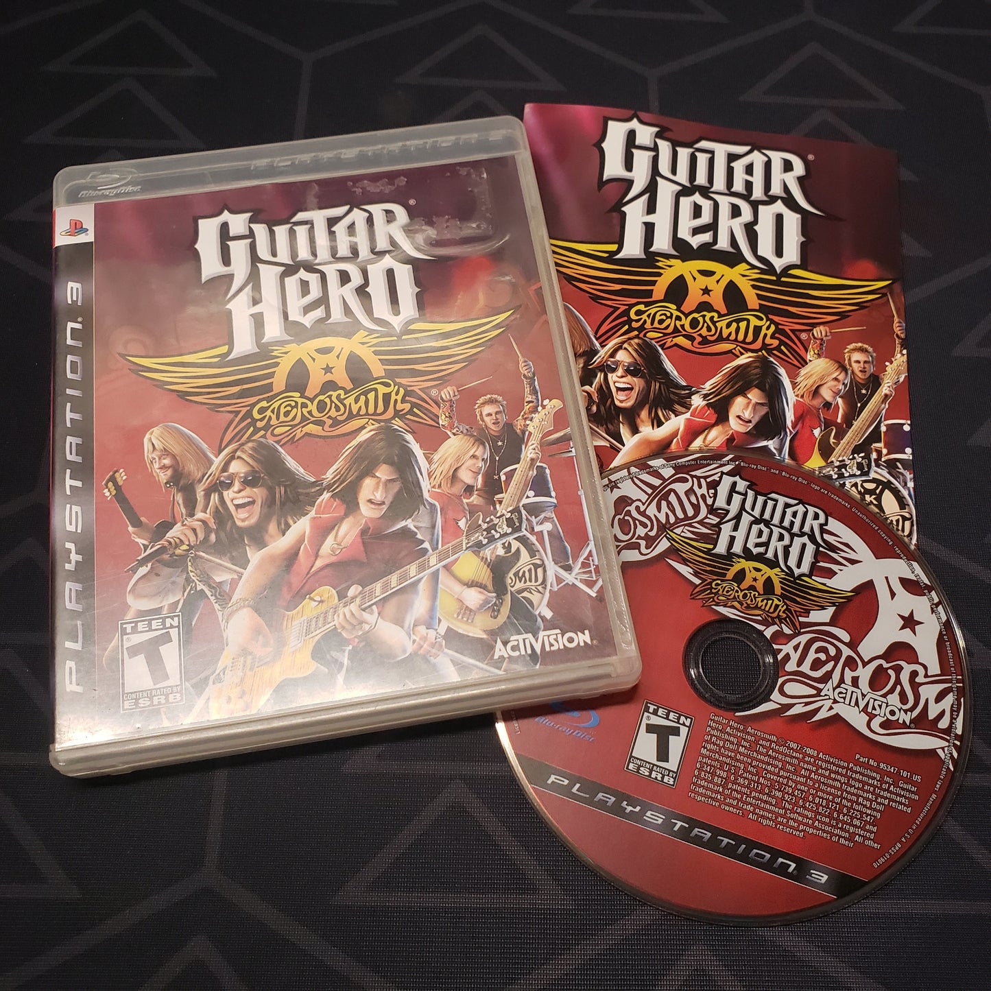 Image shows the case, manual and disc for the video game Guitar Hero: Aerosmith for Playstation 3