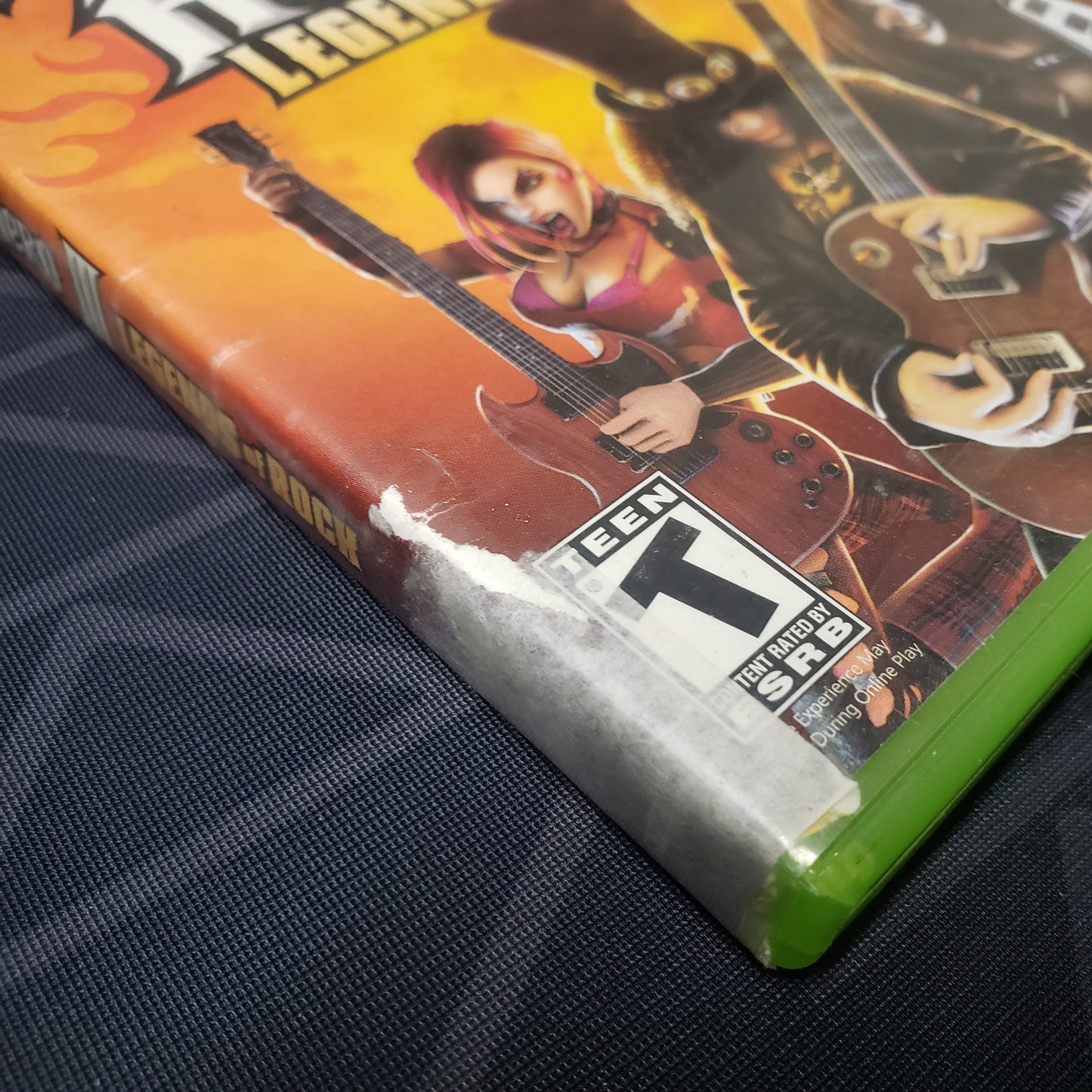 Image shows some damage to the case artwork for the video game Guitar Hero III: Legends of Rock for Xbox 360