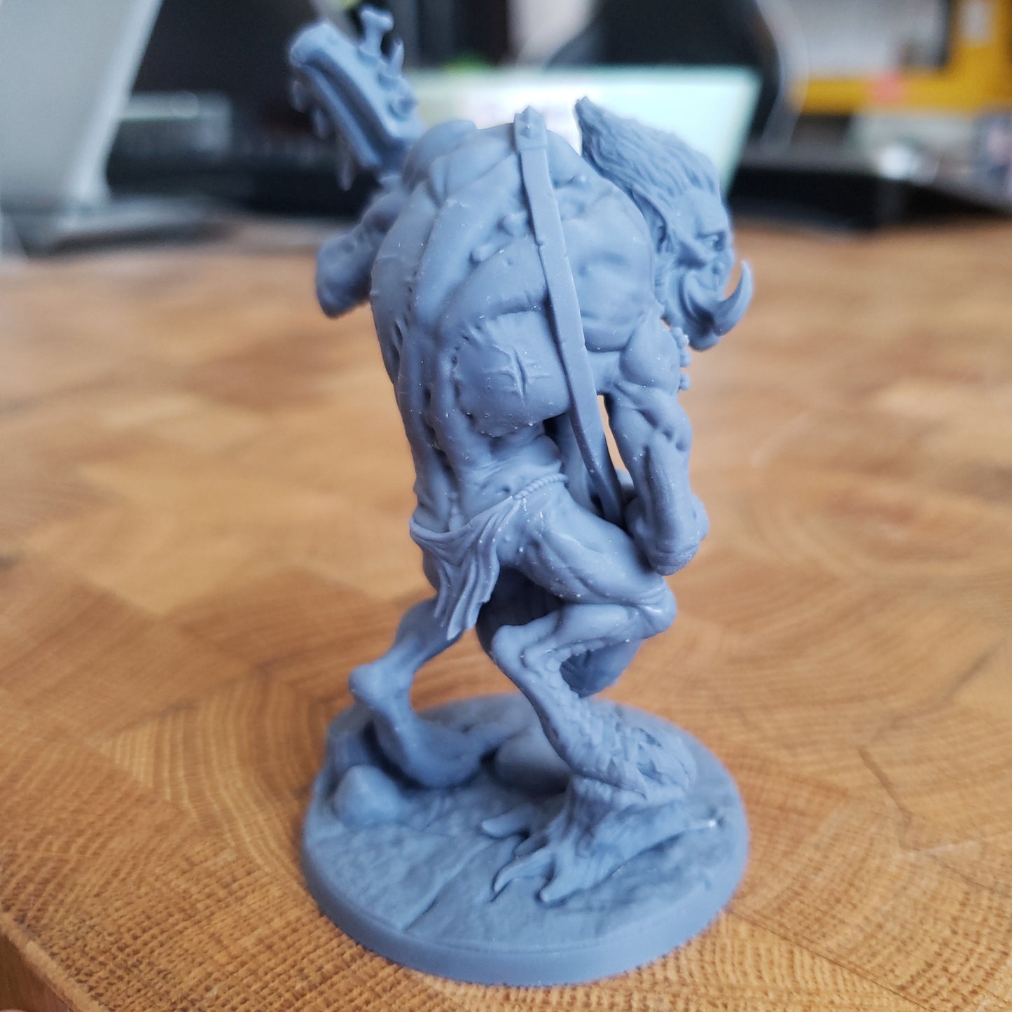 Image shows an example of a 3D printed troll guitarist gaming miniature printed in-house at All Systems Go