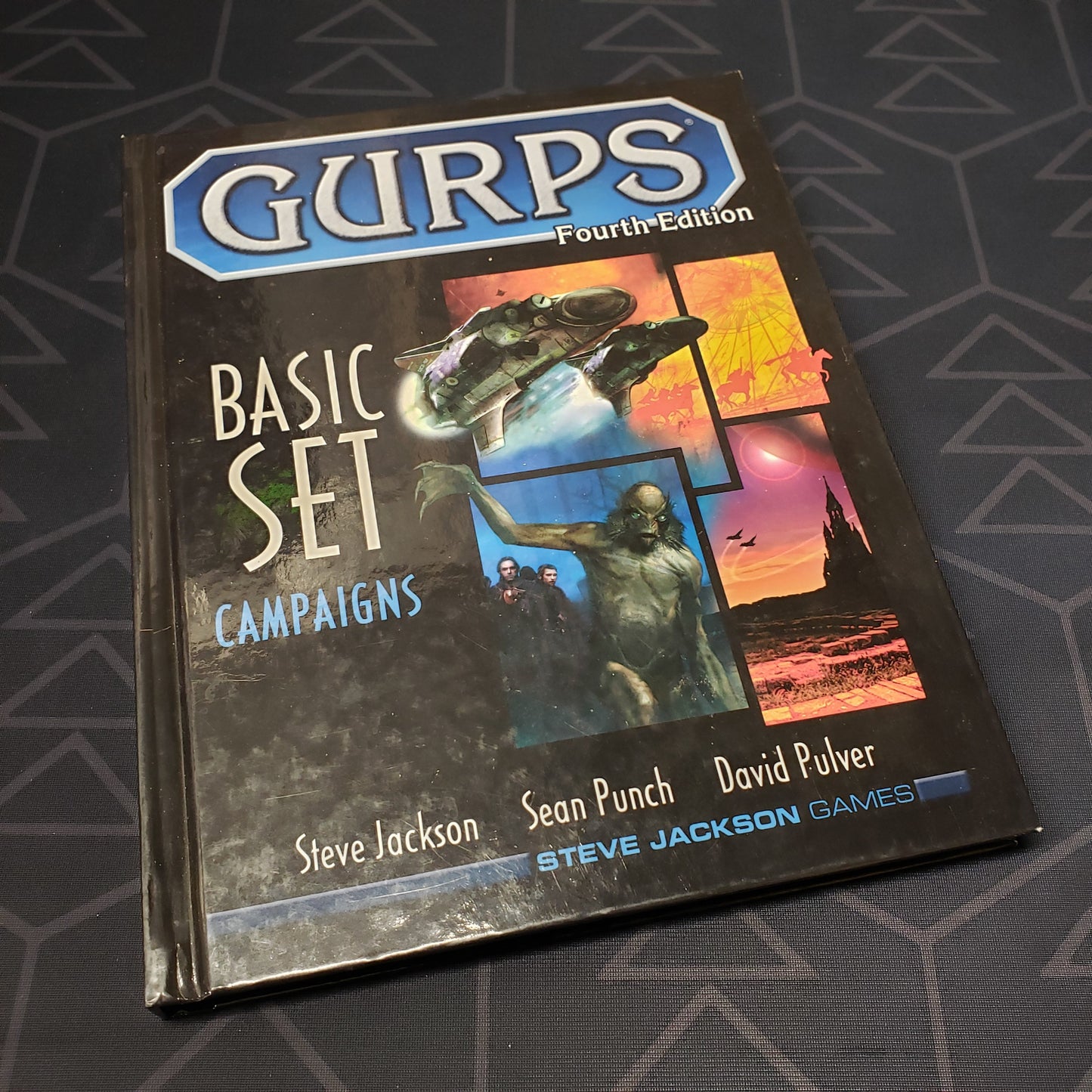 Image shows the front cover of the Basic Set: Campaigns book for the roleplaying game GURPS: Fourth Edition