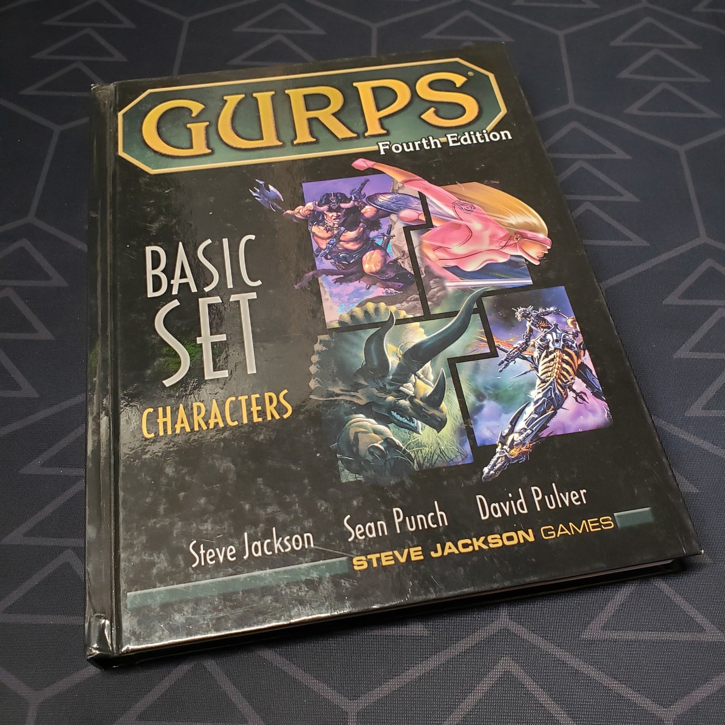 Image shows the front cover of the Basic Set: Characters book for the roleplaying game GURPS: Fourth Edition