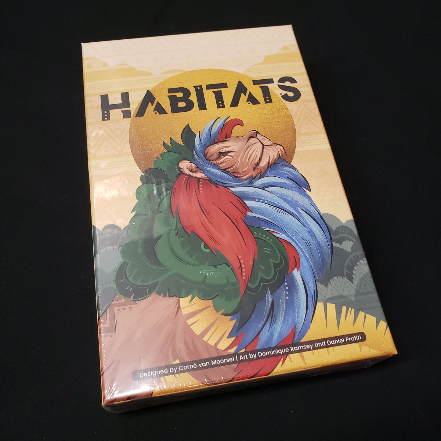 Image shows the front cover of the box of the Habitats board game