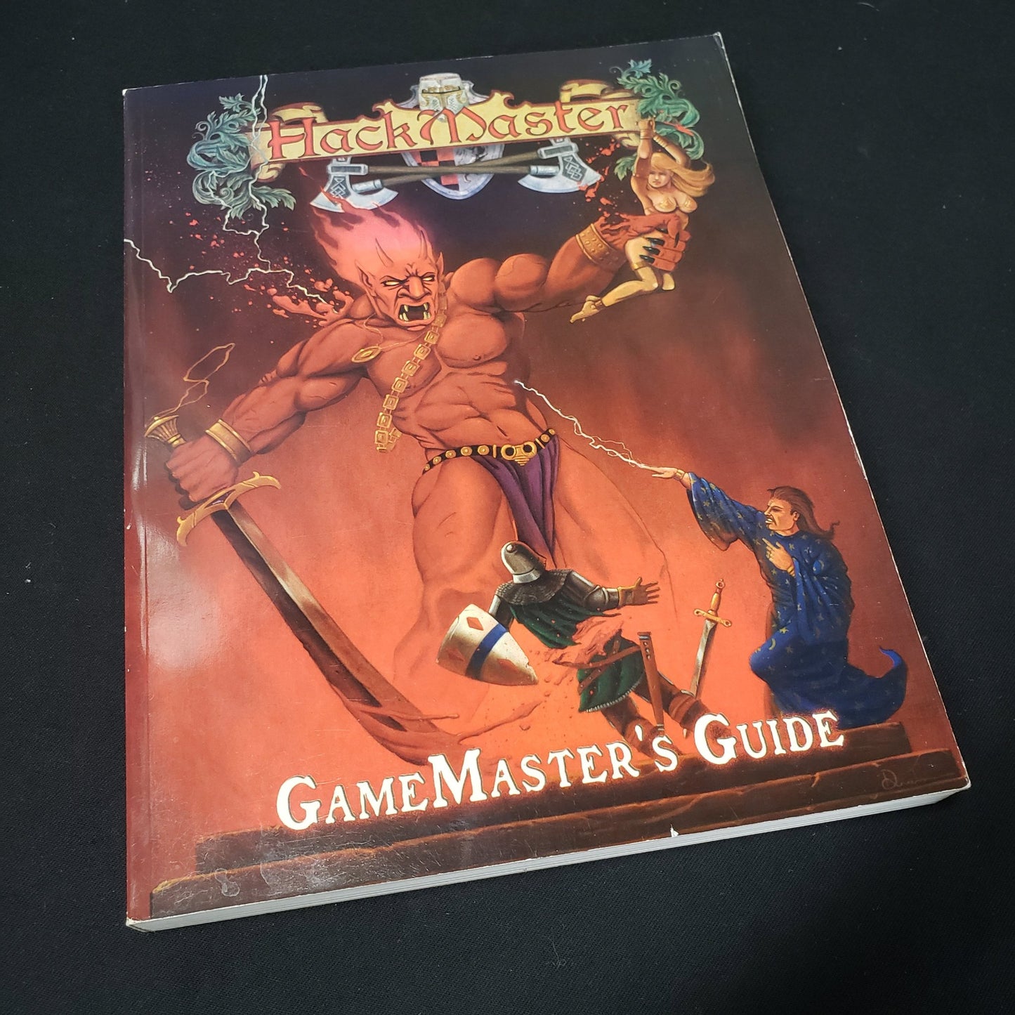 Image shows the front cover of the core rulebook for the roleplaying game Hackmaster: Fourth Edition