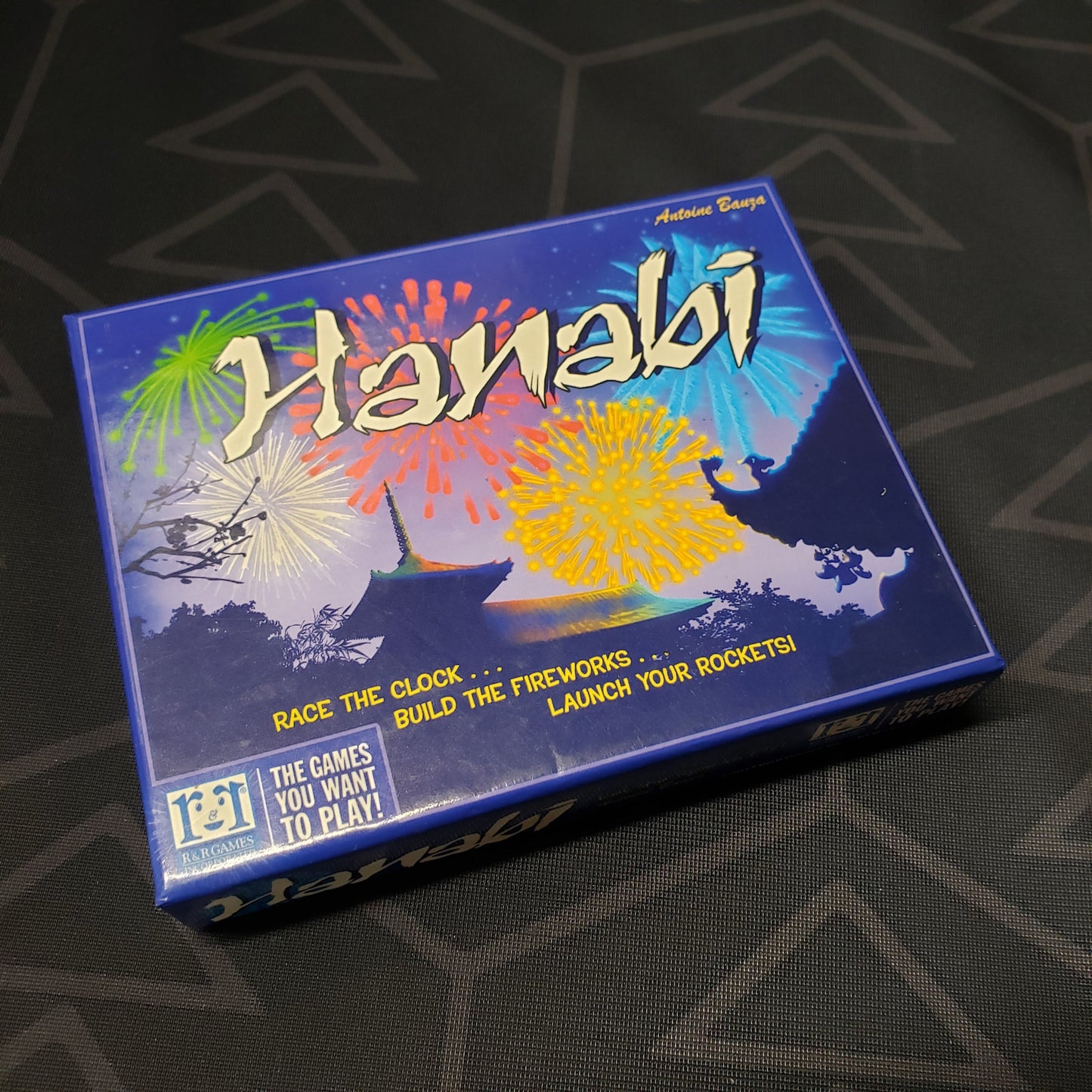 Image shows the front cover of the box for the Hanabi card game
