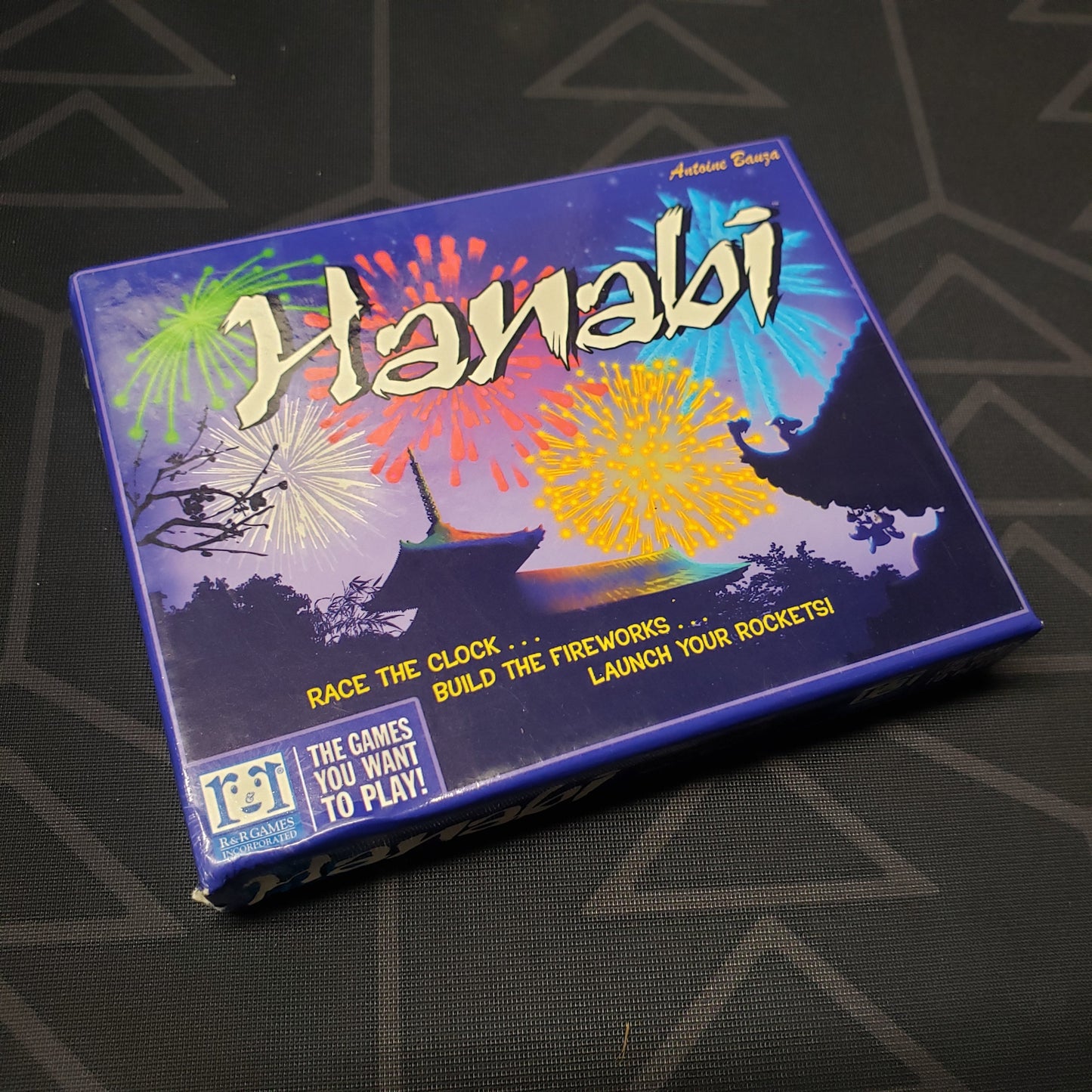 Image shows the front cover of the box for the Hanabi card game
