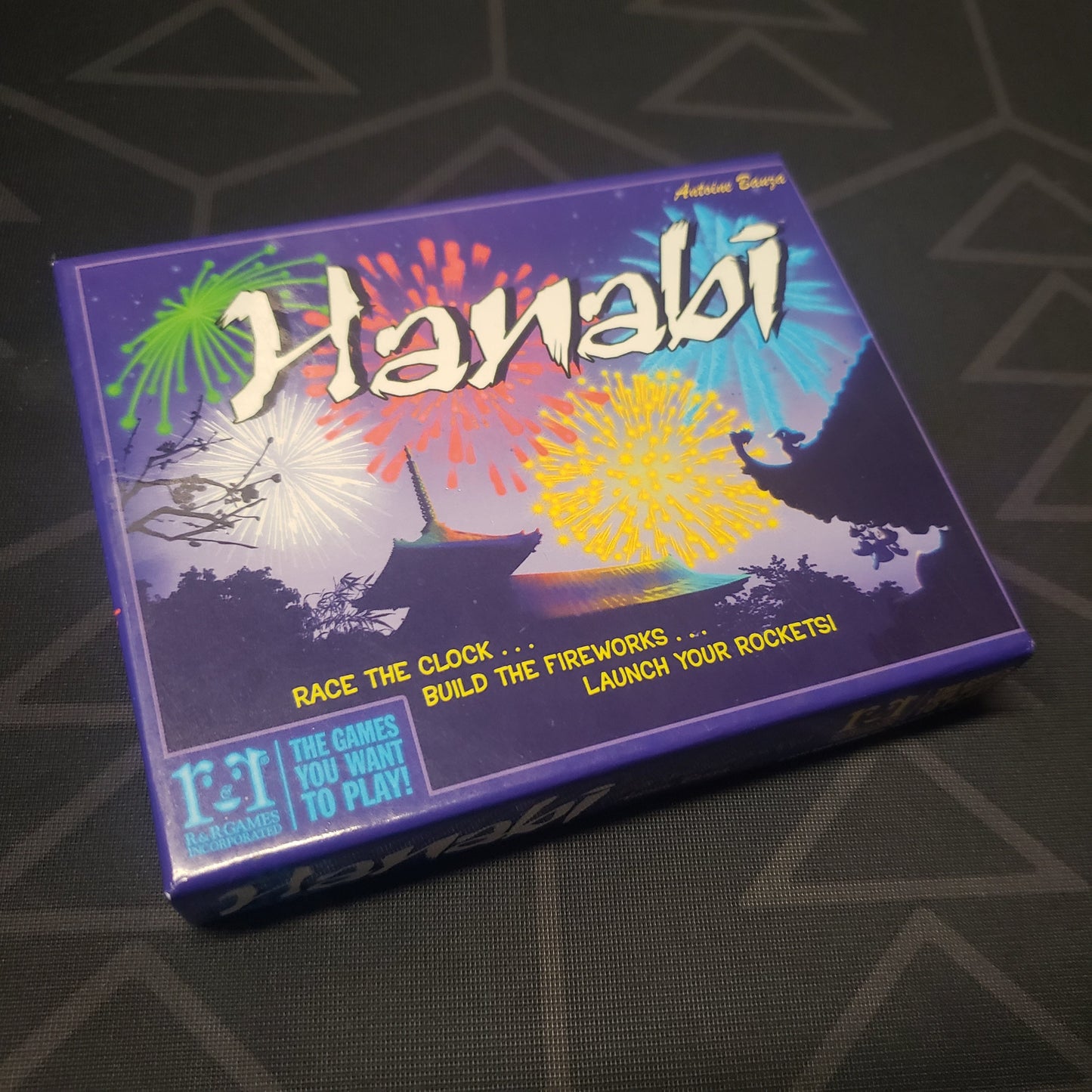 Image shows the front cover of the box for the Hanabi card game