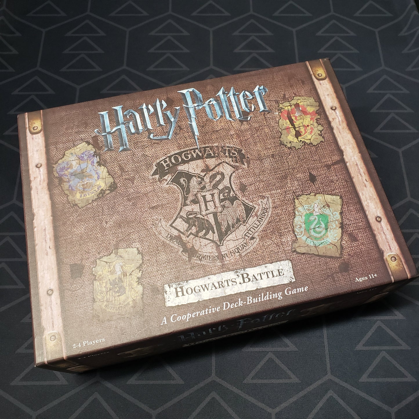 Image shows the front cover of the box of the Harry Potter: Hogwarts Battle board game
