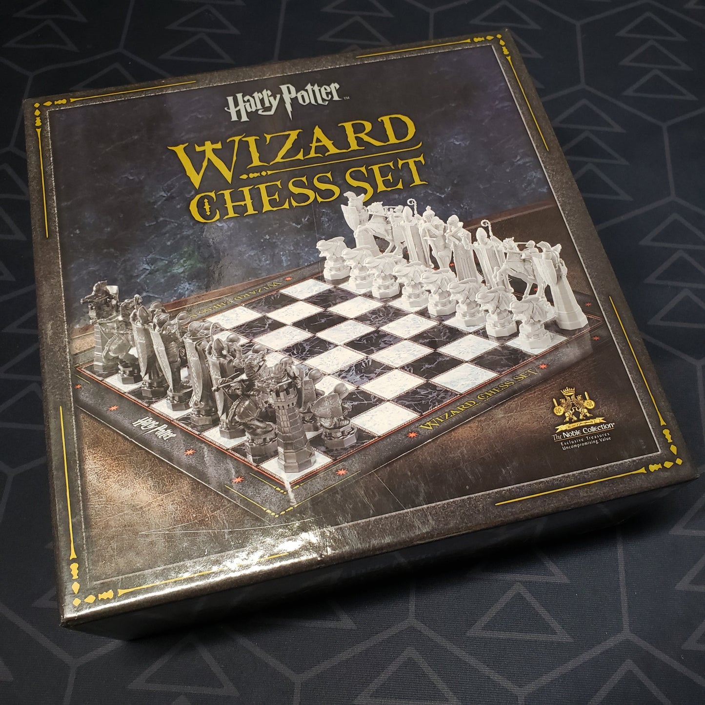 Image shows the front cover of the box for the Harry Potter Wizard Chess Set
