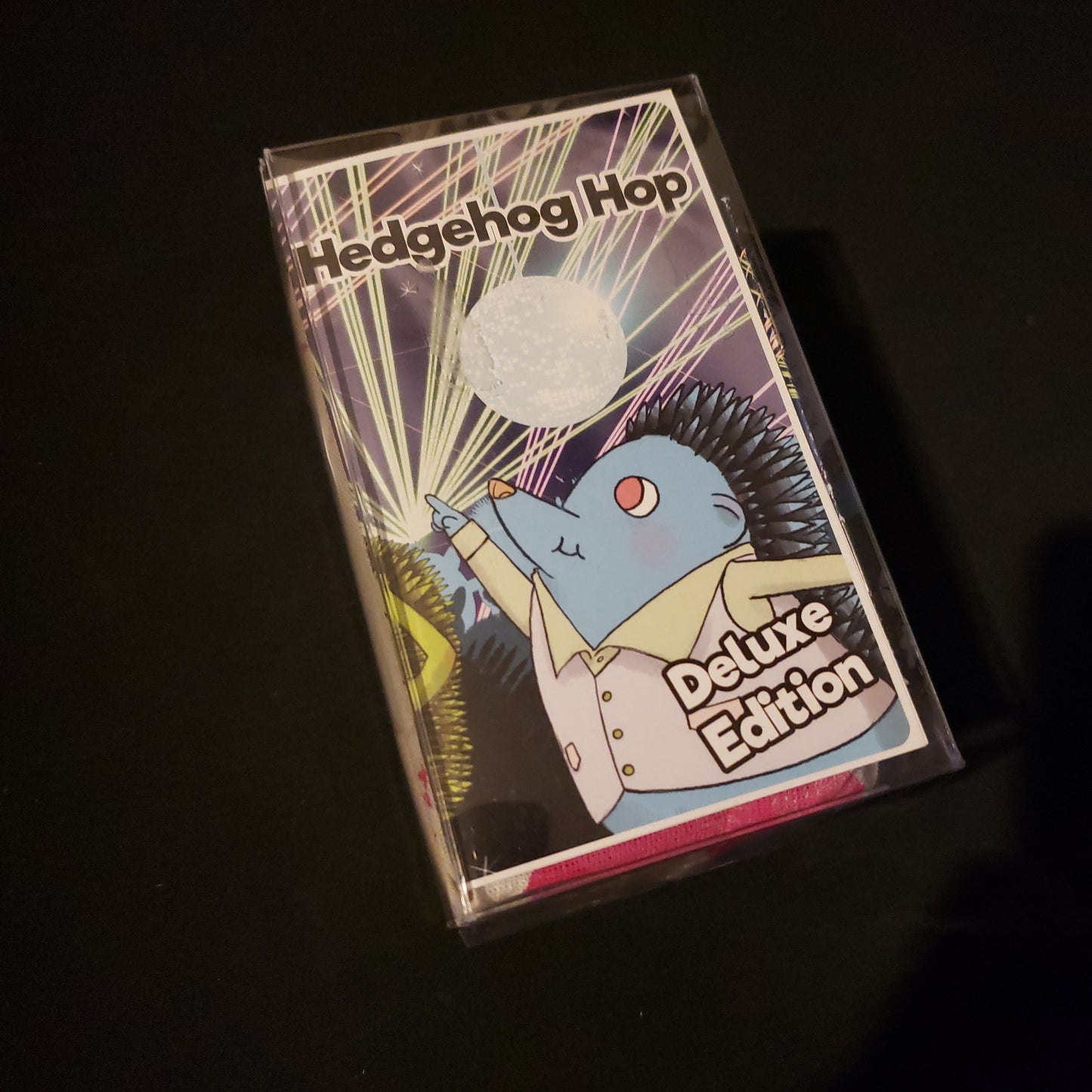 Image shows the front cover of the box of the Hedgehog Hop card game