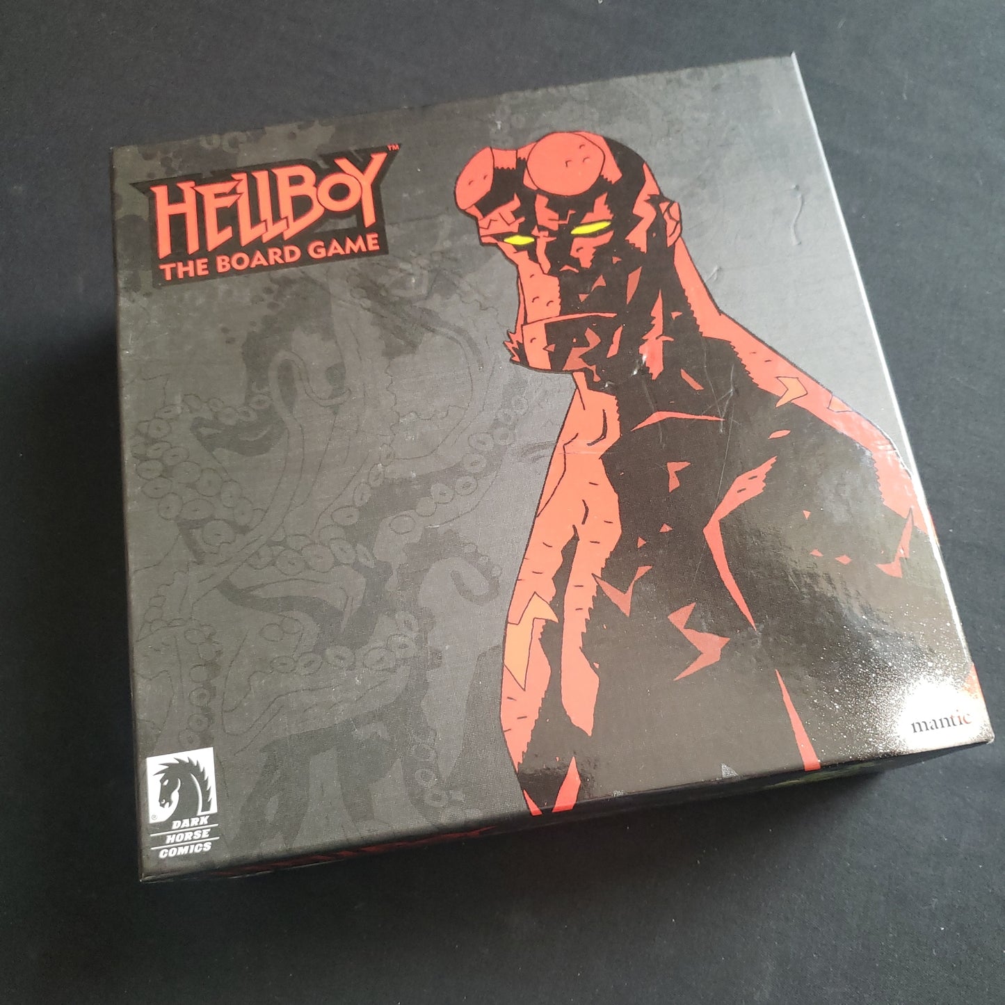 Image shows the front cover of the box of Hellboy: The Board Game