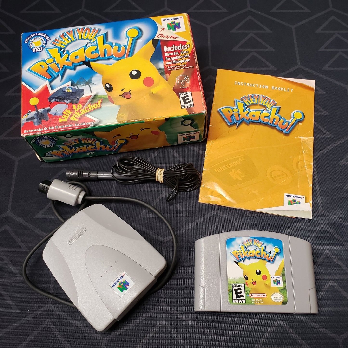 Image shows the box, manual, cartridge and microphone accessories for the video game Hey You, Pikachu! for Nintendo 64