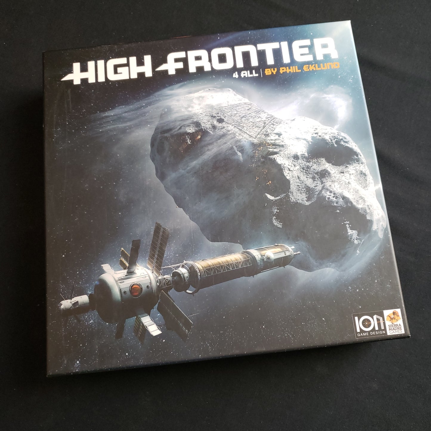 Image shows the front cover of the box of the High Frontier 4 All board game