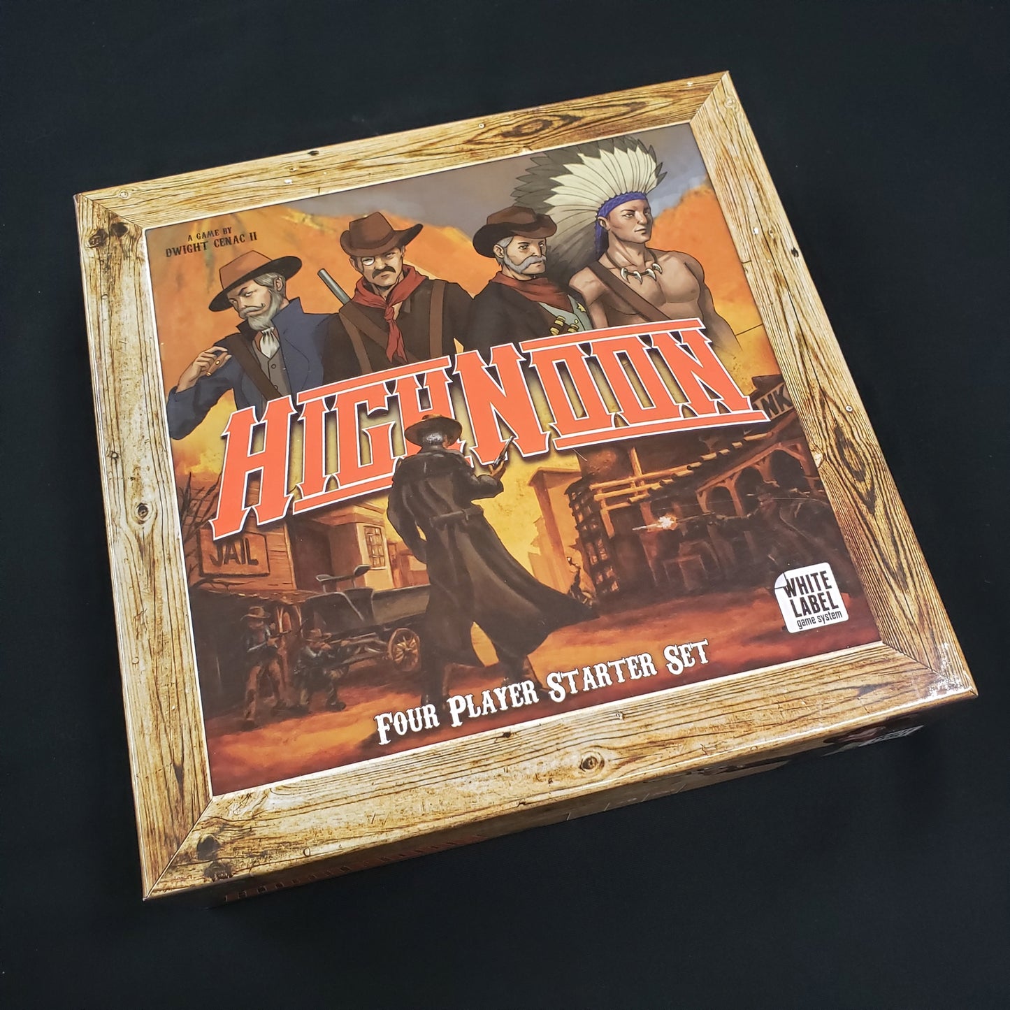 Image shows the front cover of the box of the High Noon board game