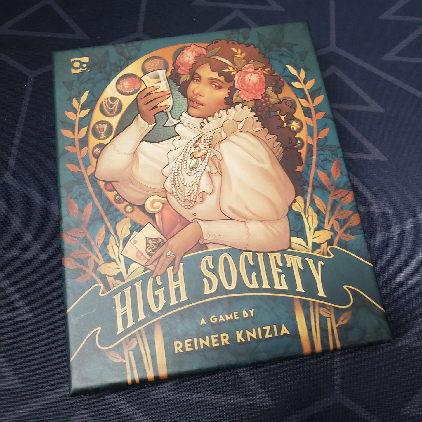 Image shows the front cover of the box of the High Society card game