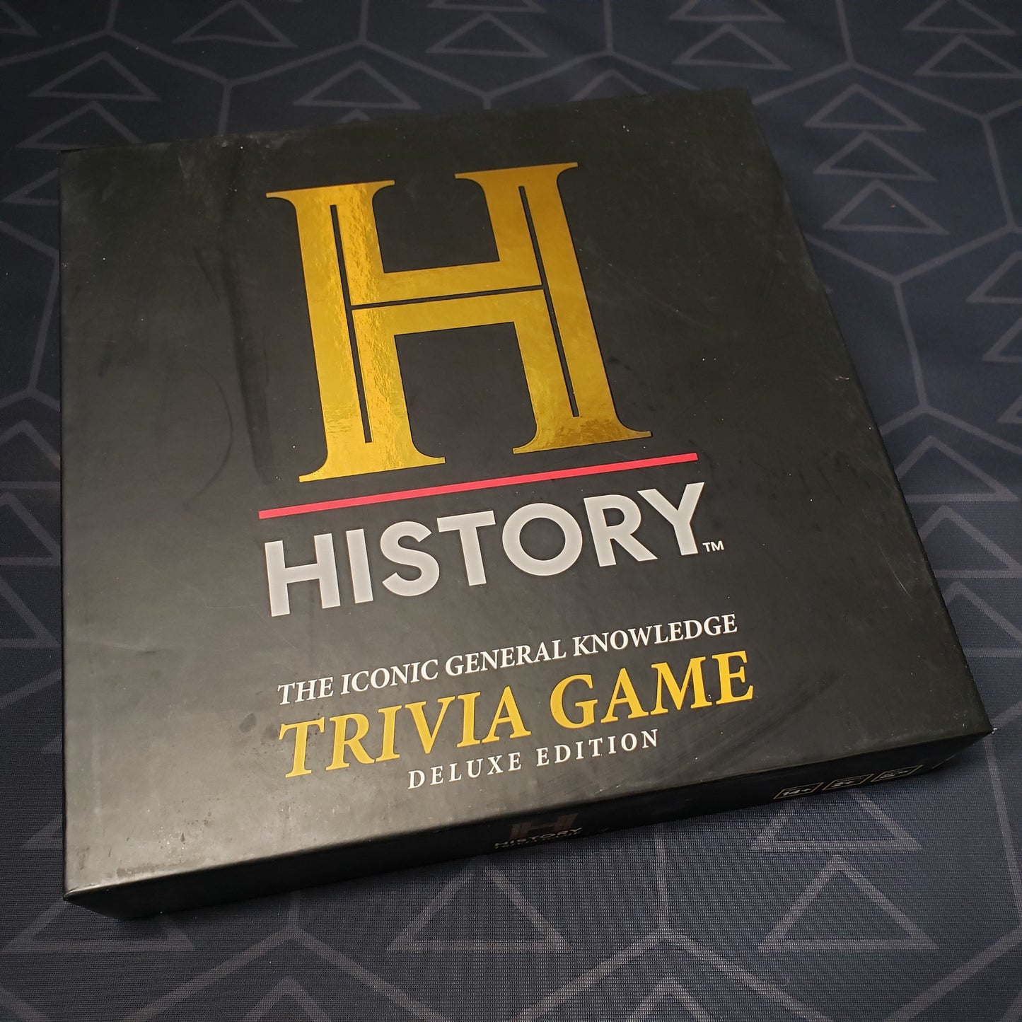 Image shows the front cover of the box for the History Channel Trivia Game (Deluxe Ediiton) card game