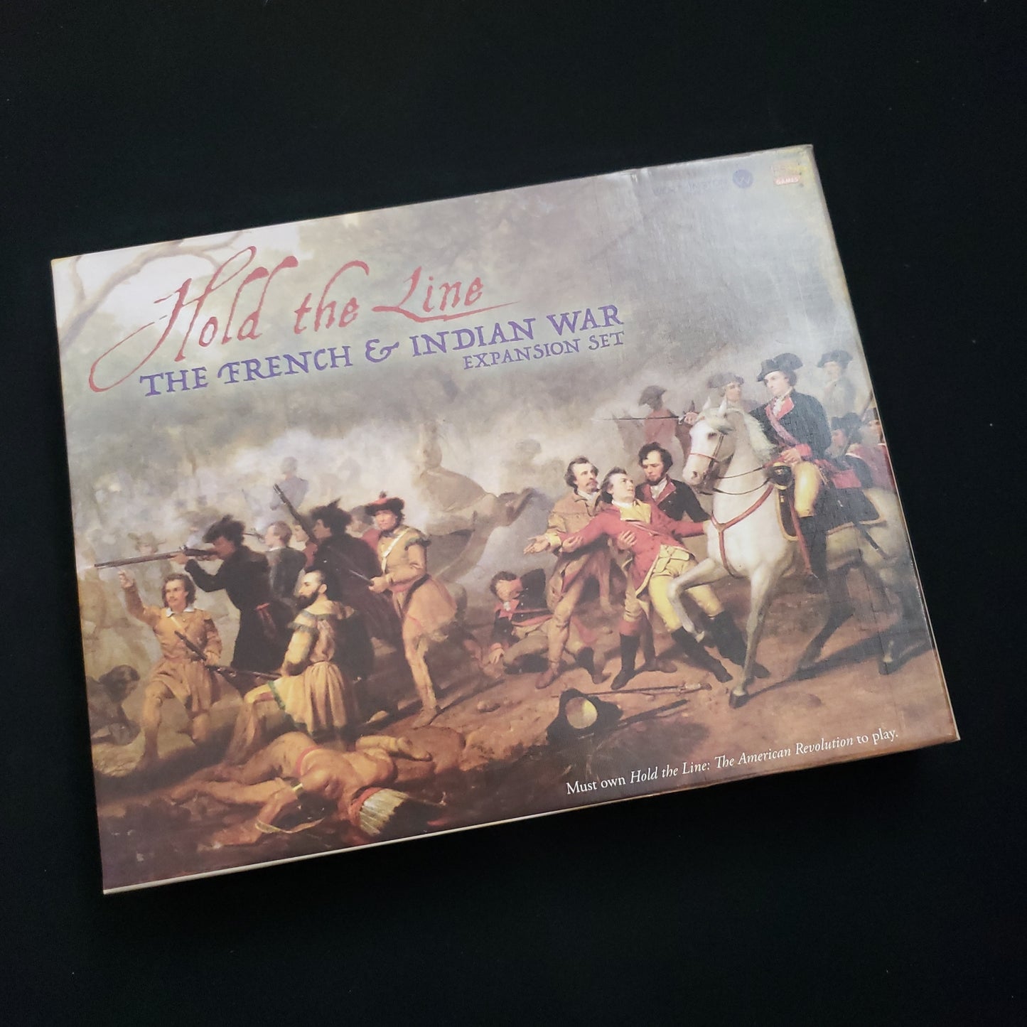 Image shows the front cover of the box of the French & Indian War expansion for the board game Hold the Line