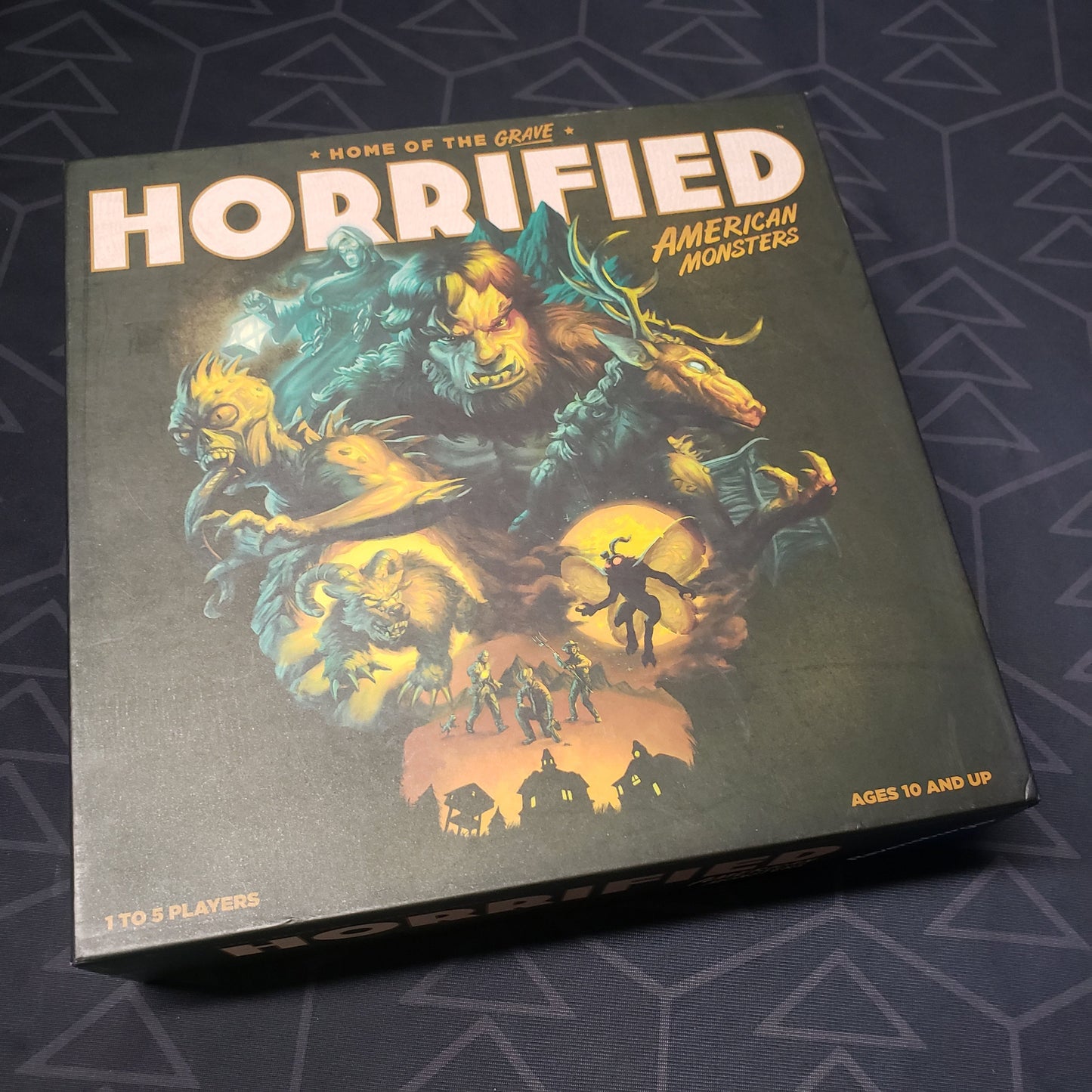 Image shows the front cover of the box for the Horrified: American Monsters board game