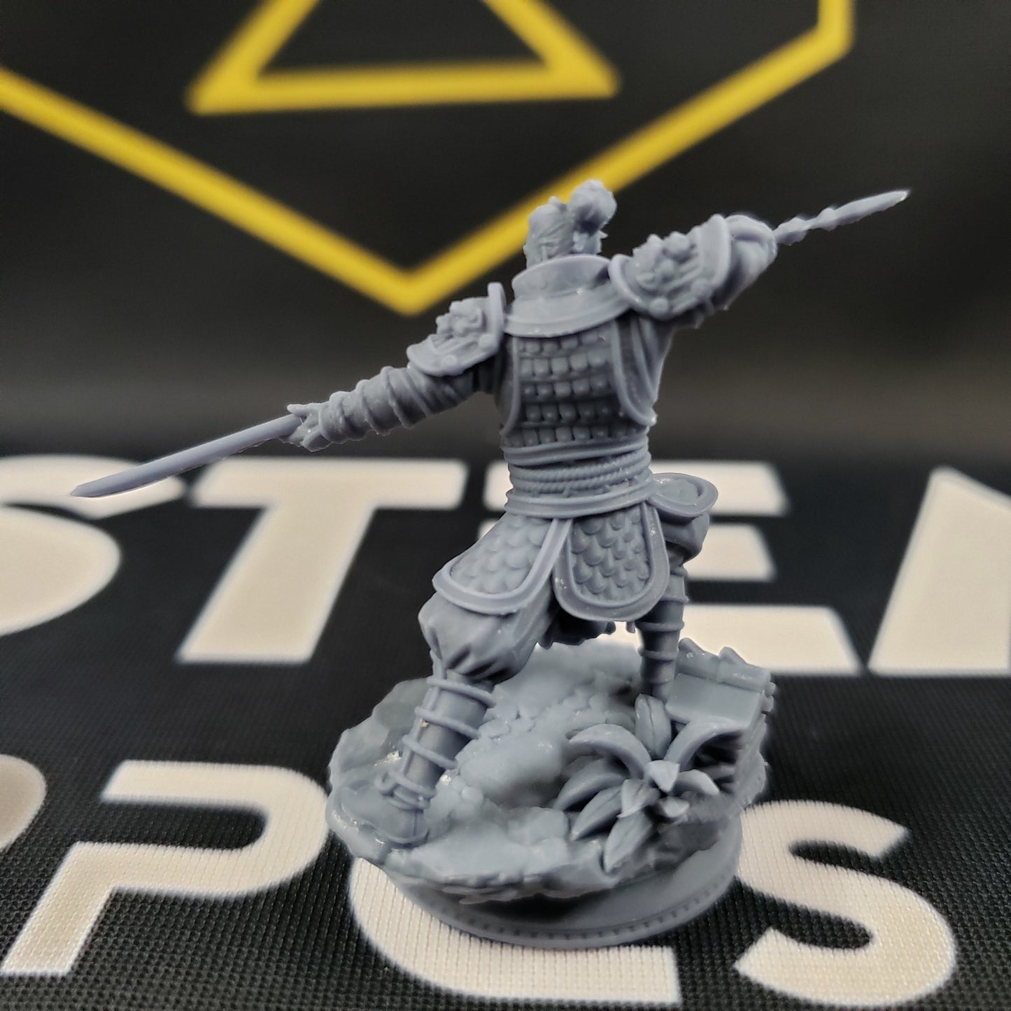 Image shows the back of a 3D printed human fighter gaming miniature