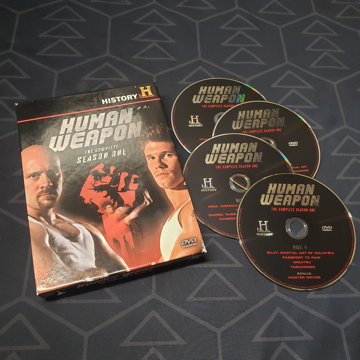 Image shows the case & four discs for the first season of Human Weapon on DVD