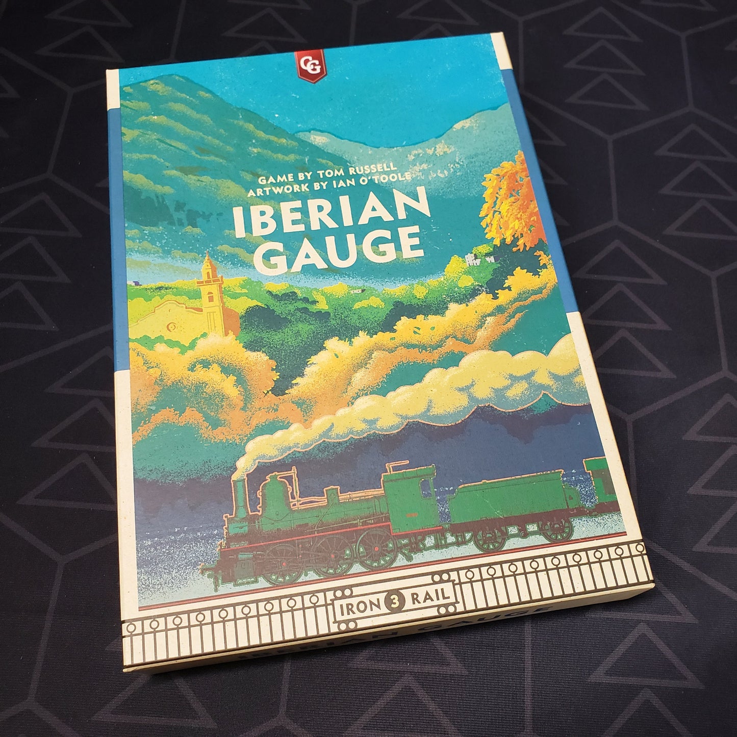 Image shows the front cover of the box of the Iberian Gauge board game