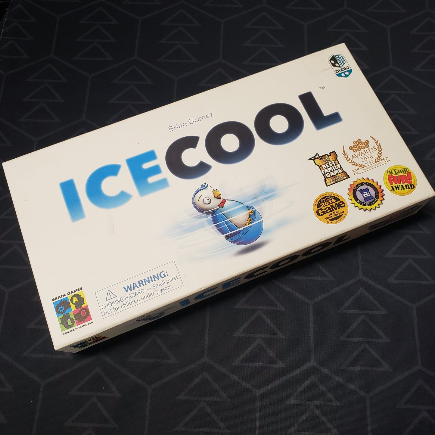 Image shows the front cover of the box of the ICECOOL board game