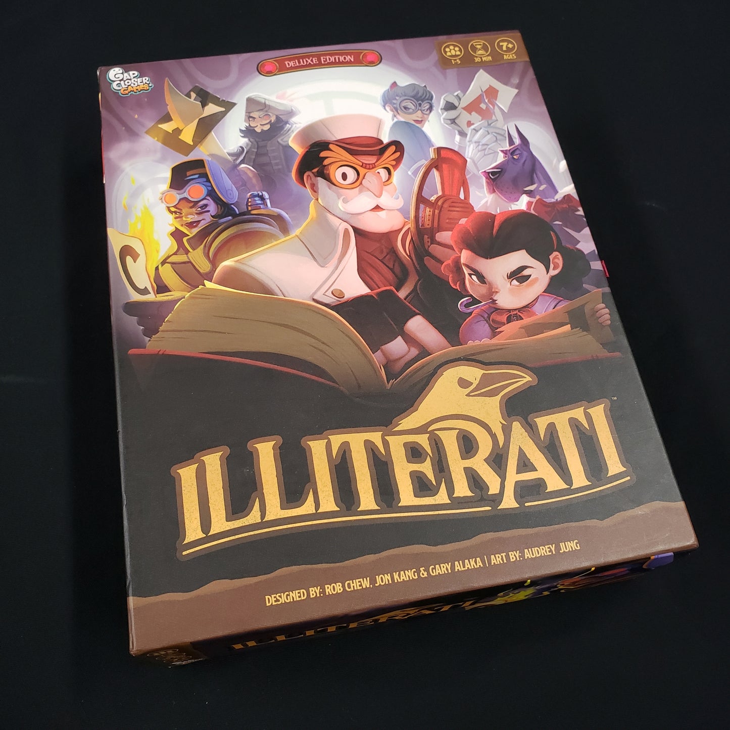 Image shows the front cover of the box of the Illiterati board game