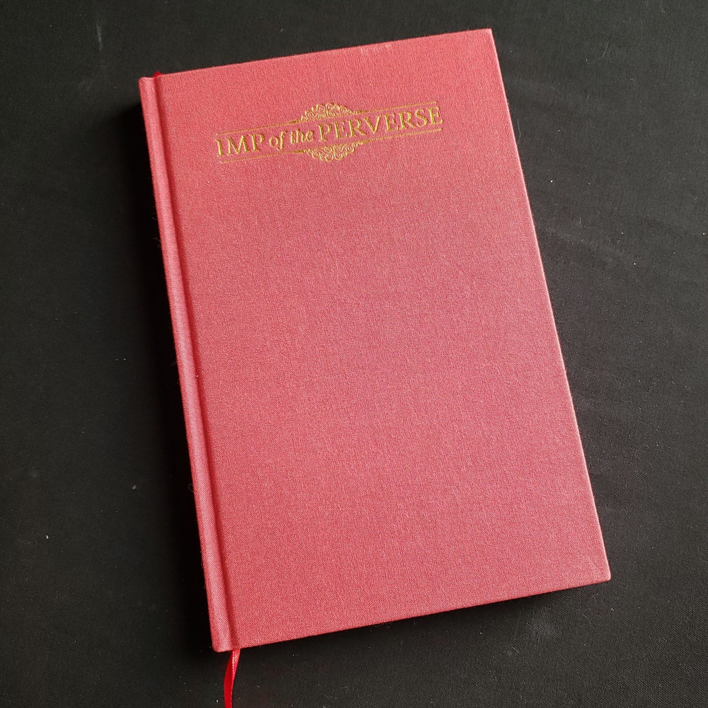 Image shows the front cover of the Imp of the Perverse roleplaying game book