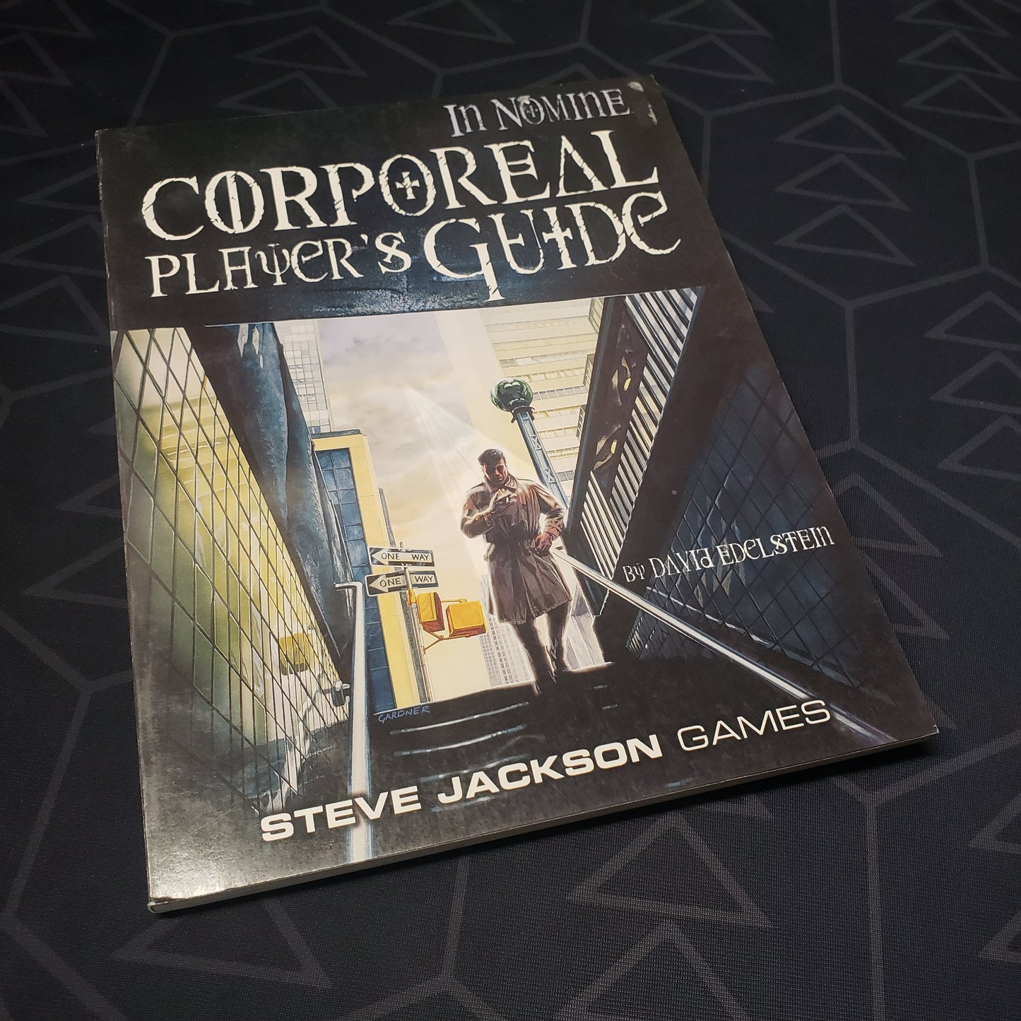 Image shows the front cover of the Corporeal Player's Guide book for the roleplaying game In Nomine