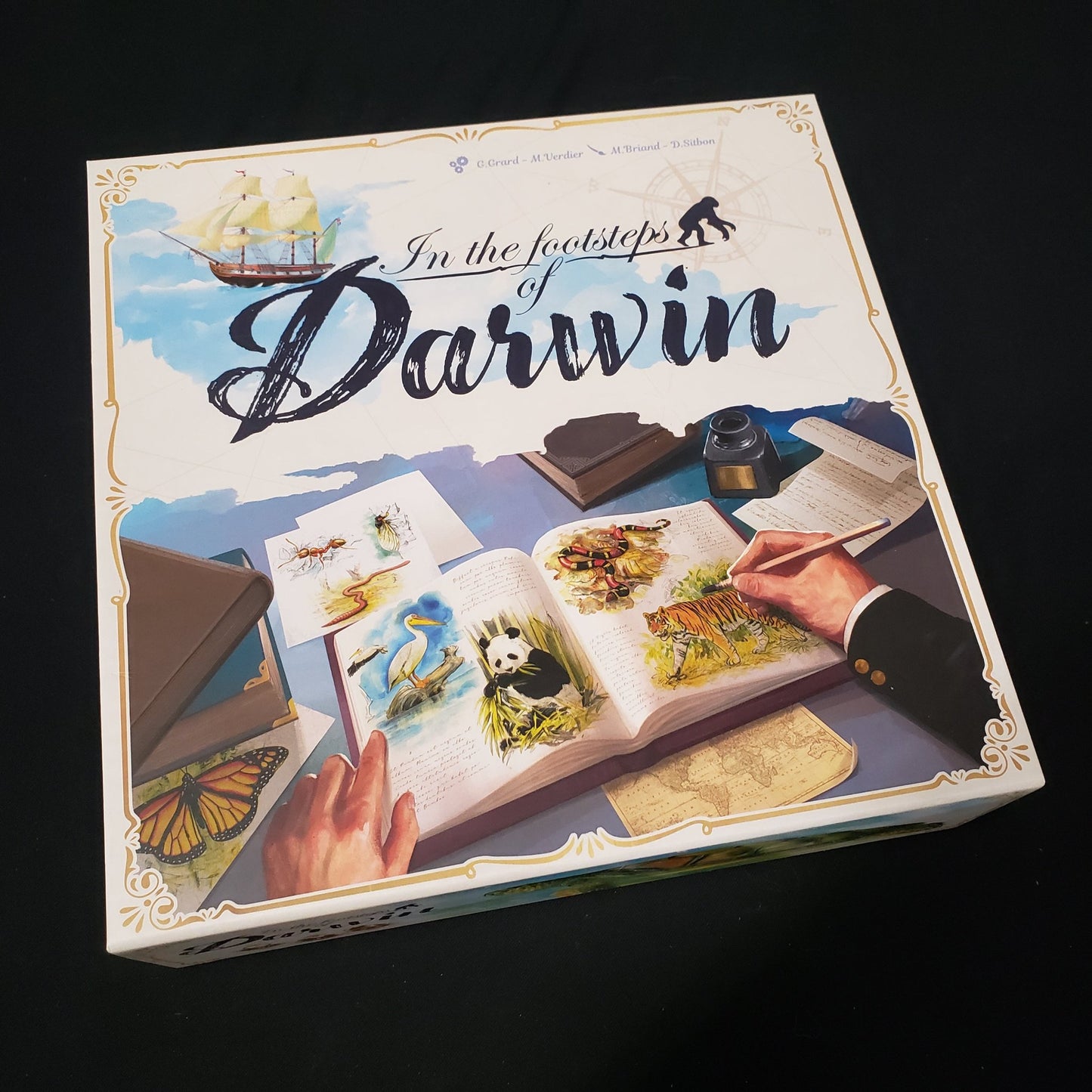 Image shows the front cover of the box of the In the Footsteps Of Darwin board game