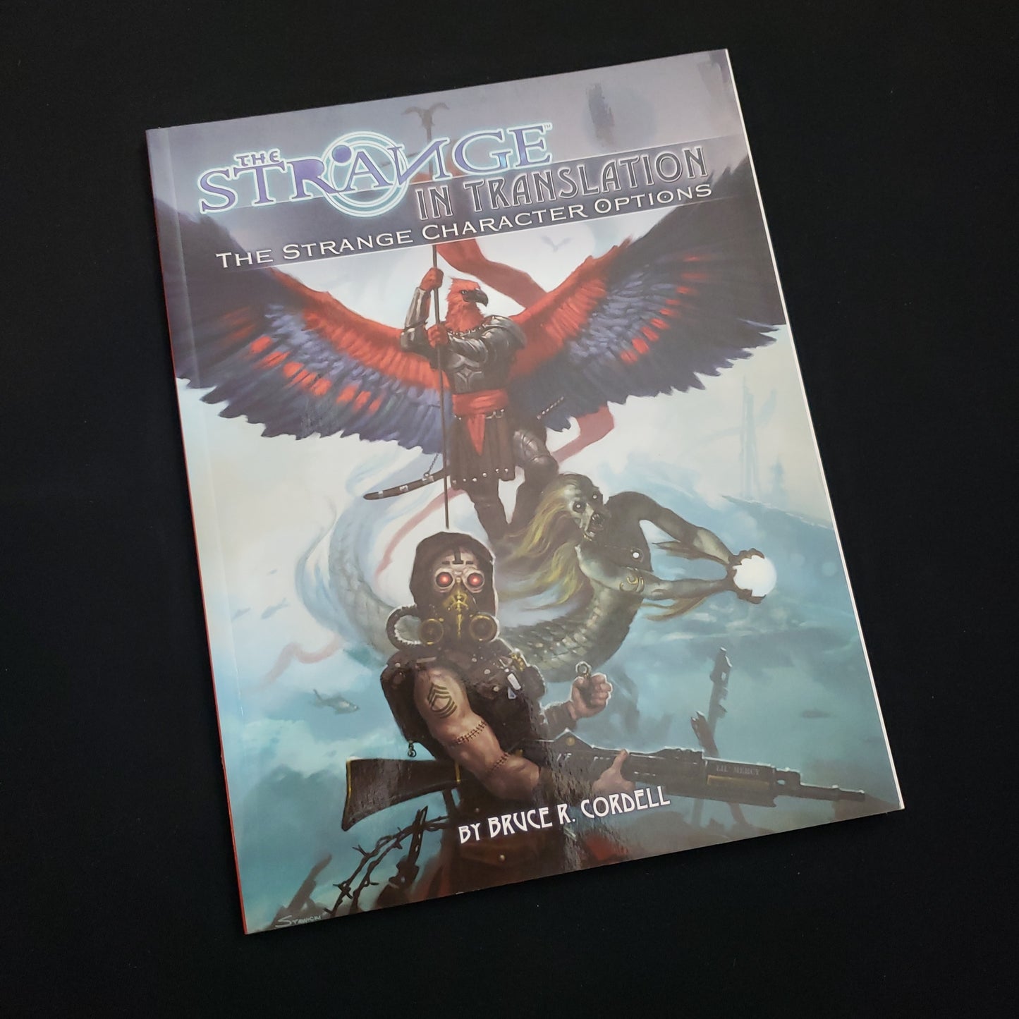 Image shows the front cover of the In Translation book for the roleplaying game The Strange