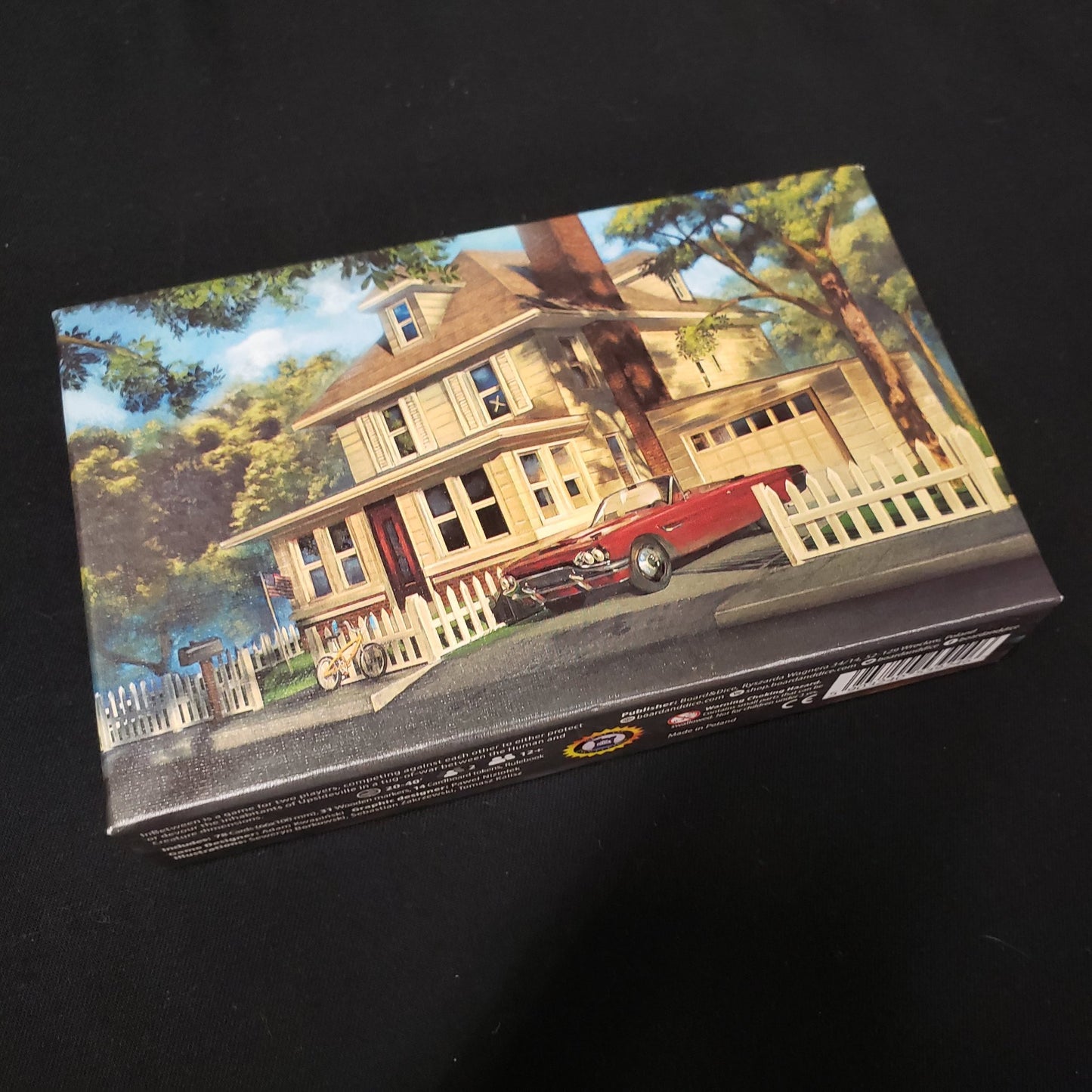 Image shows the front cover of the box of the InBetween board game