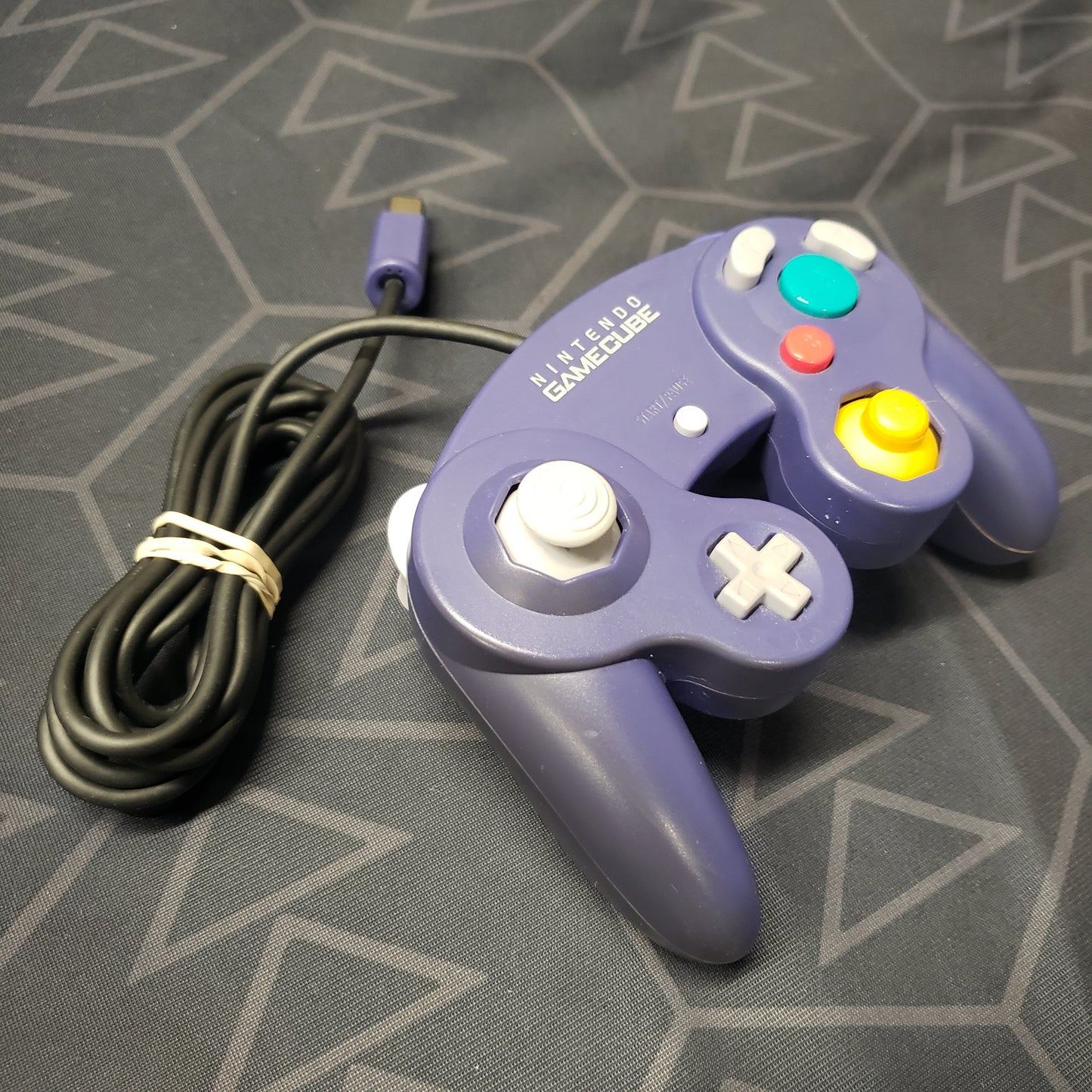 Image shows an Indigo color gaming controller for the GameCube