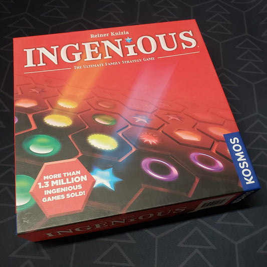 Image shows the front cover of the box of the Ingenious board game