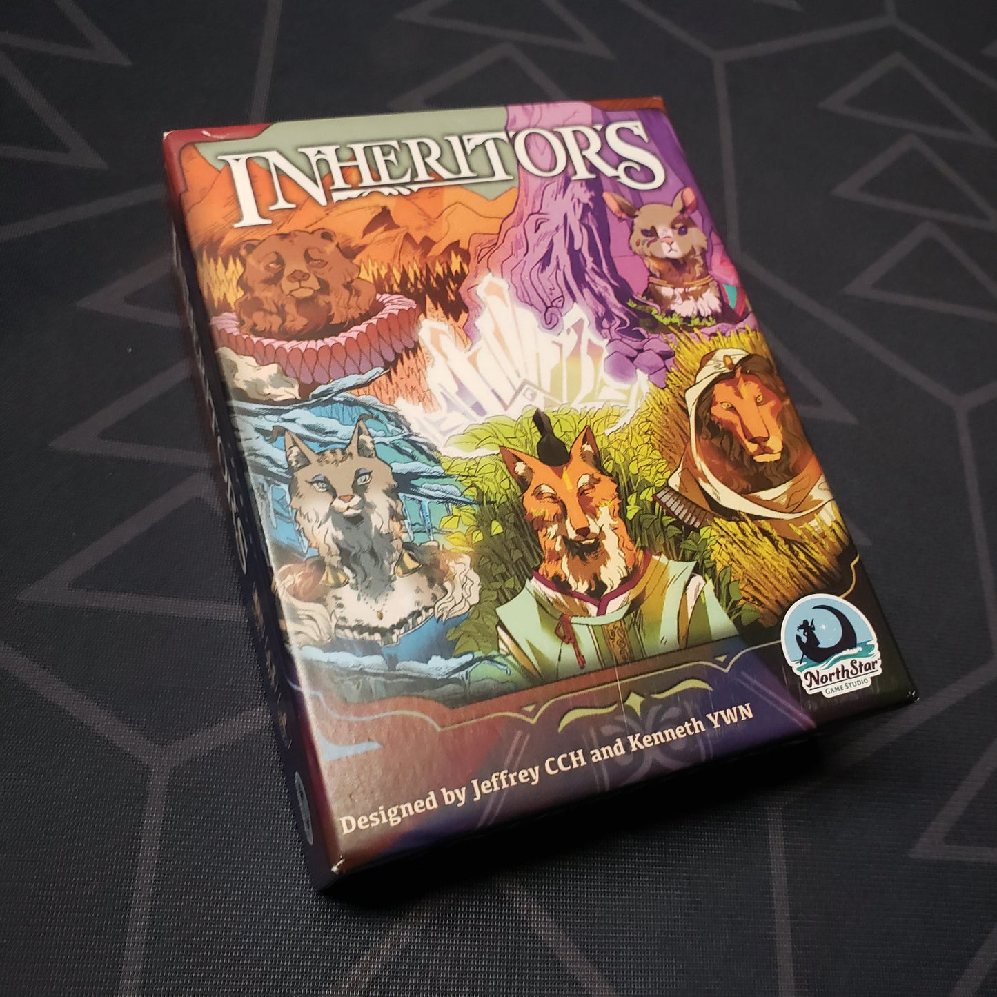 Image shows the front cover of the box of the Inheritors card game