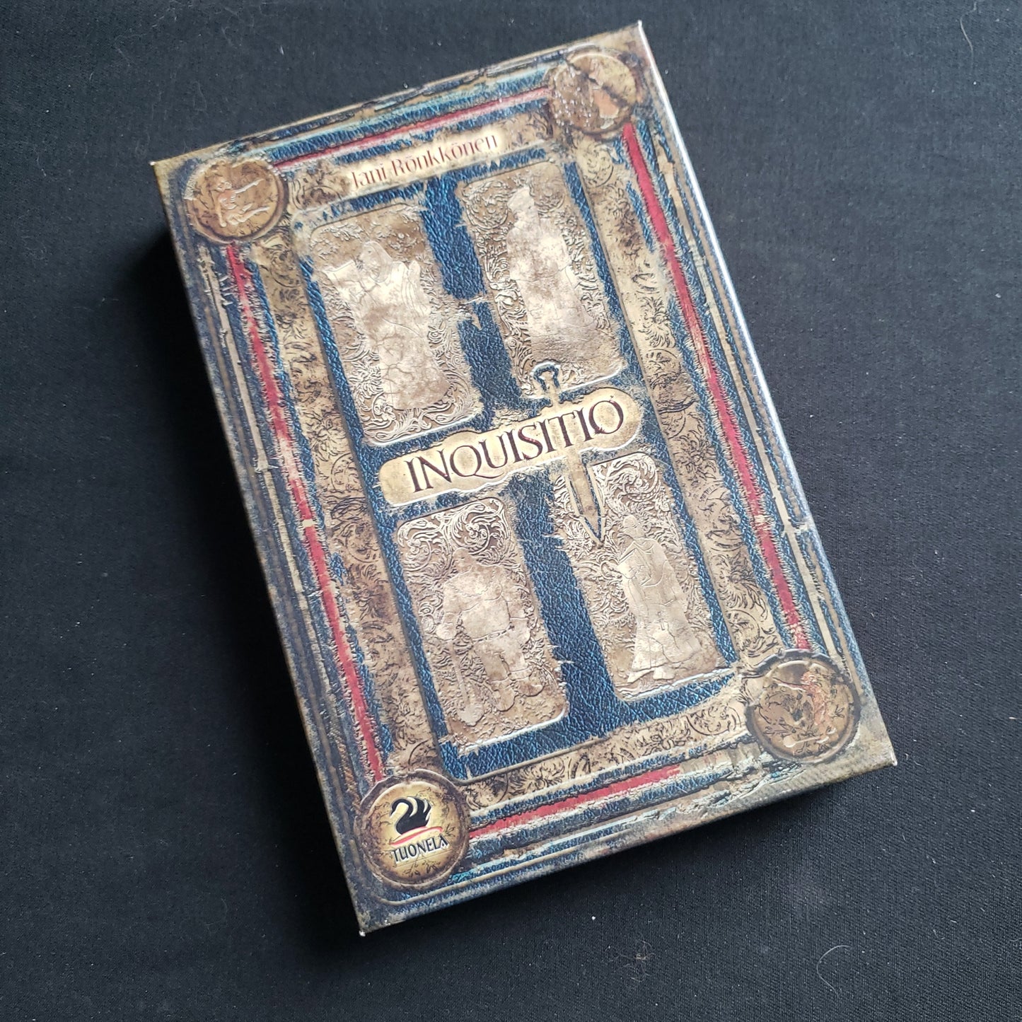 Image shows the front cover of the box of the Inquisitio card game