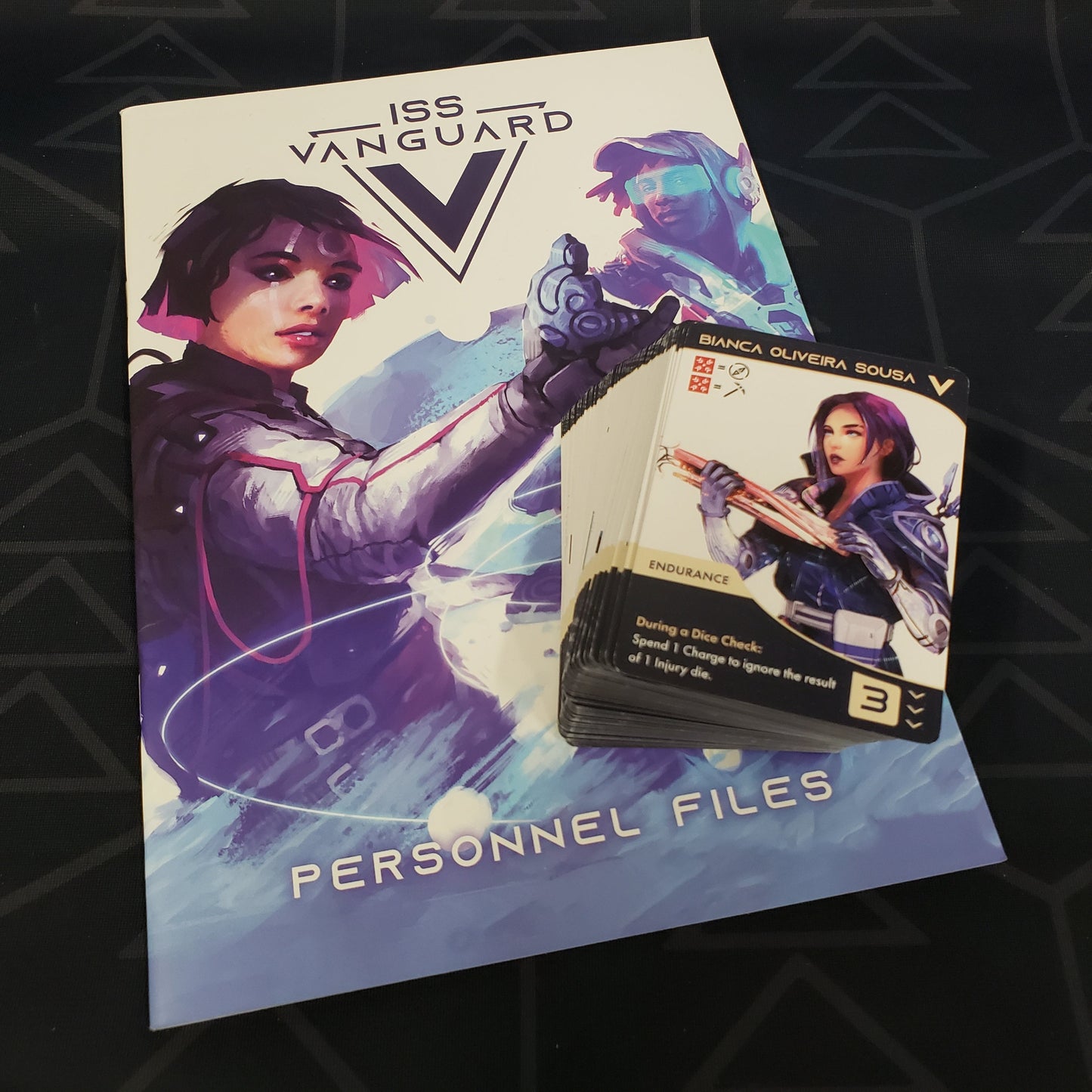 Image shows the book & cards for the Personnel Files expansion for the board game ISS Vanguard