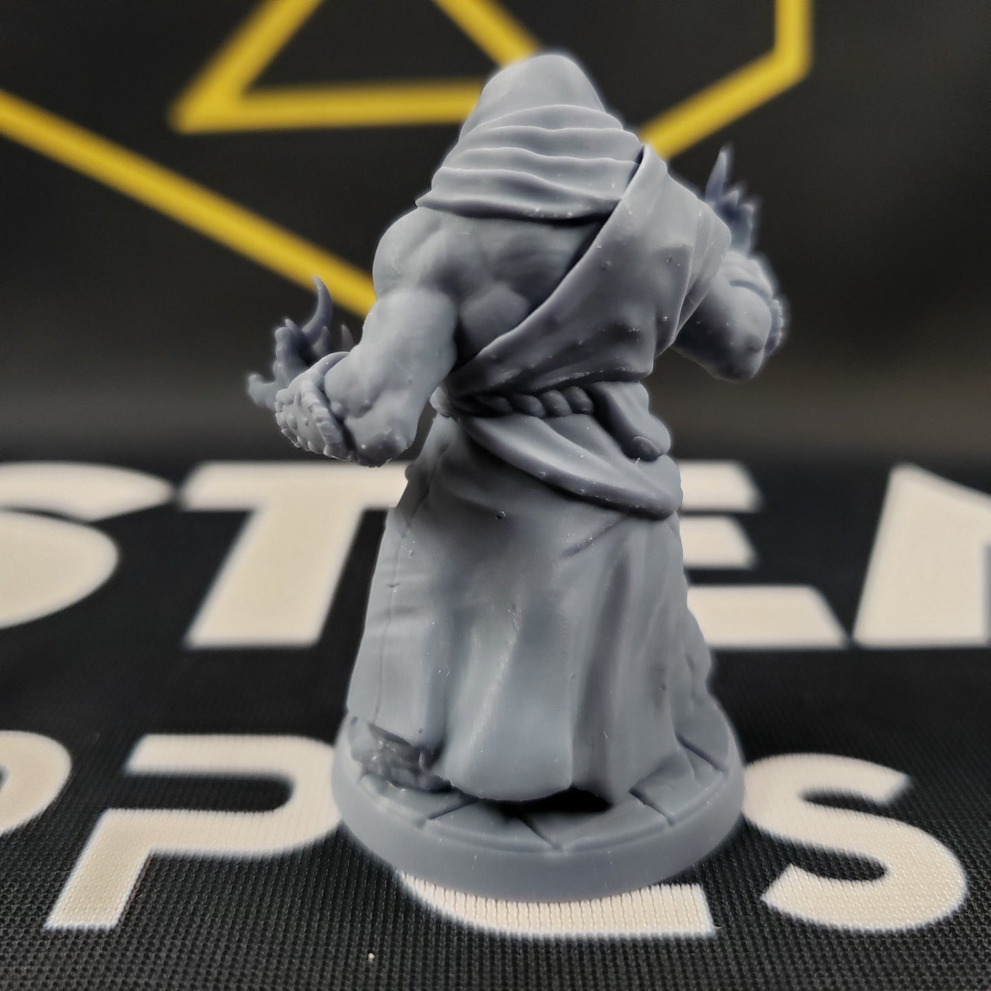 Image shows the back of a 3D printed loxodon monk gaming miniature