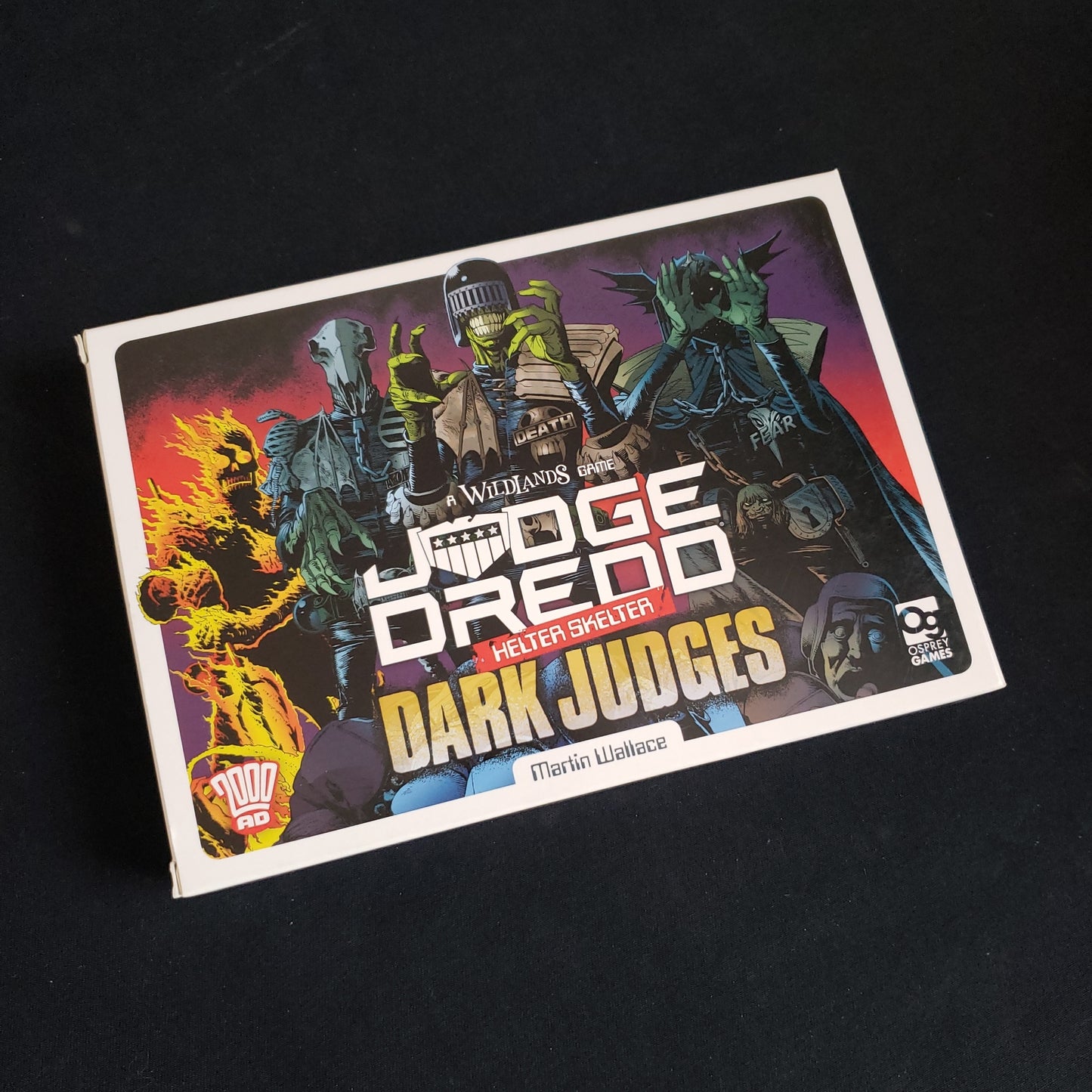 Image shows the front cover of the box of the Dark Judges expansion for the Judge Dredd: Helter Skelter board game