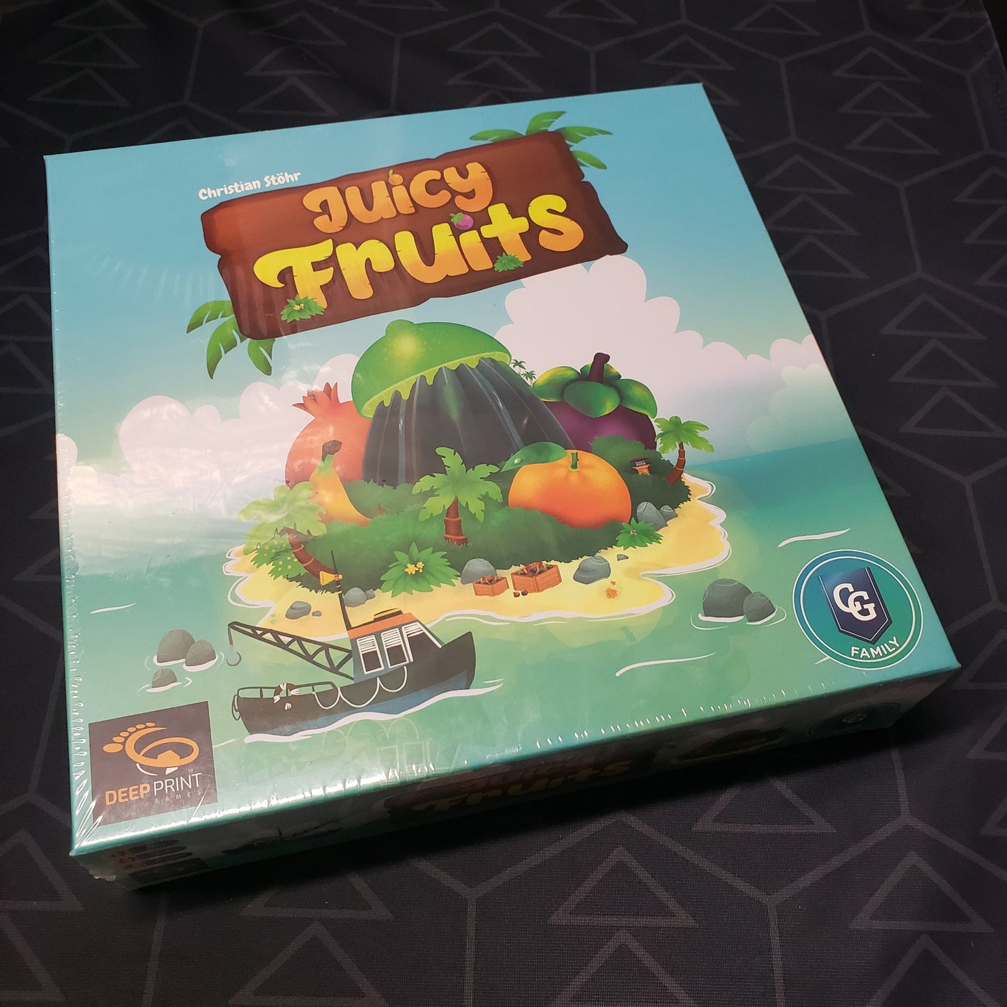 Image shows the front cover of the box of the Juicy Fruits board game
