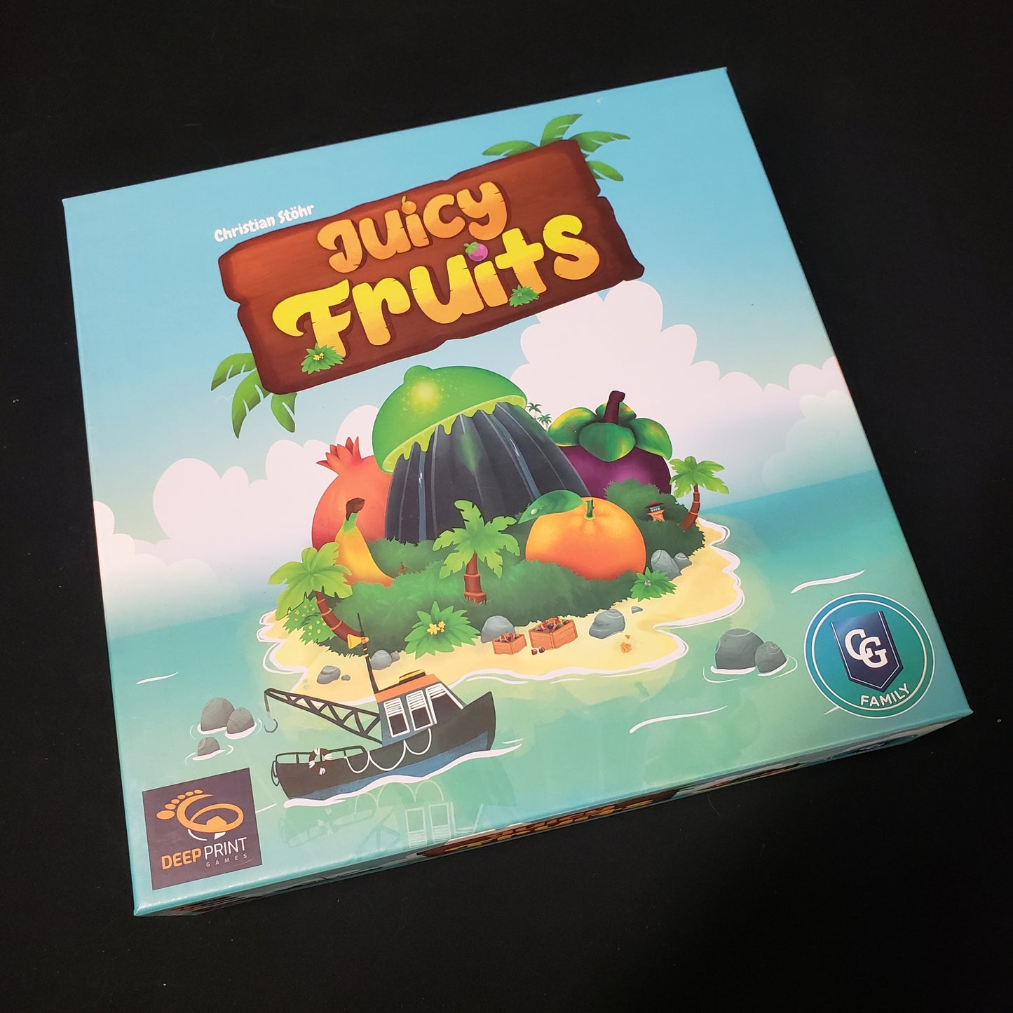 Image shows the front cover of the box of the Juicy Fruits board game
