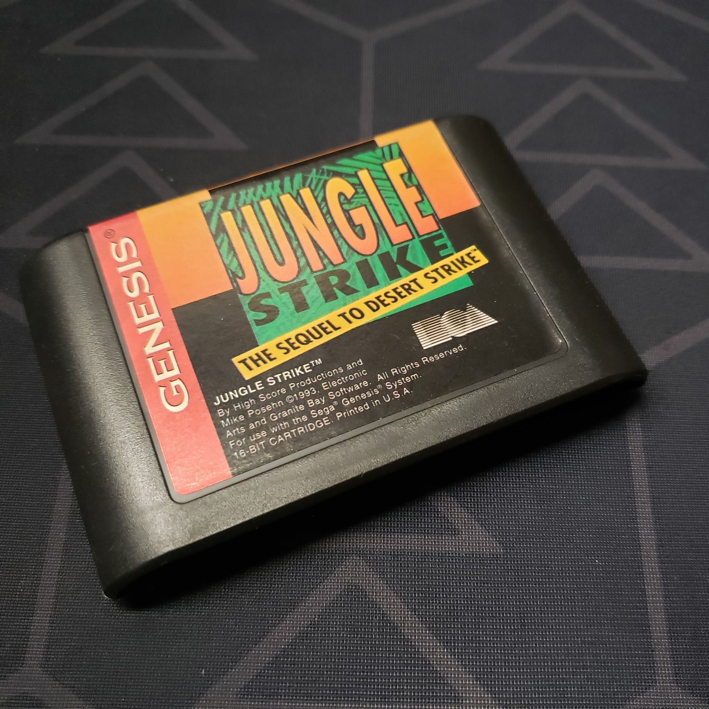 Image shows the front of the cartridge for the video game Jungle Strike for Sega Genesis