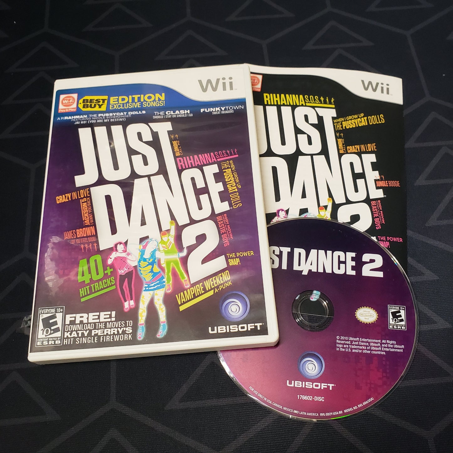 Image shows the case, manual & disc for the video game Just Dance 2 for Nintendo Wii