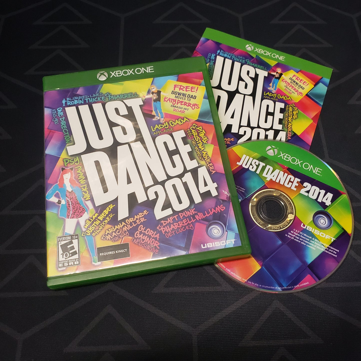 Image shows the case, manual and disc for the video game Just Dance 2014 for Xbox One